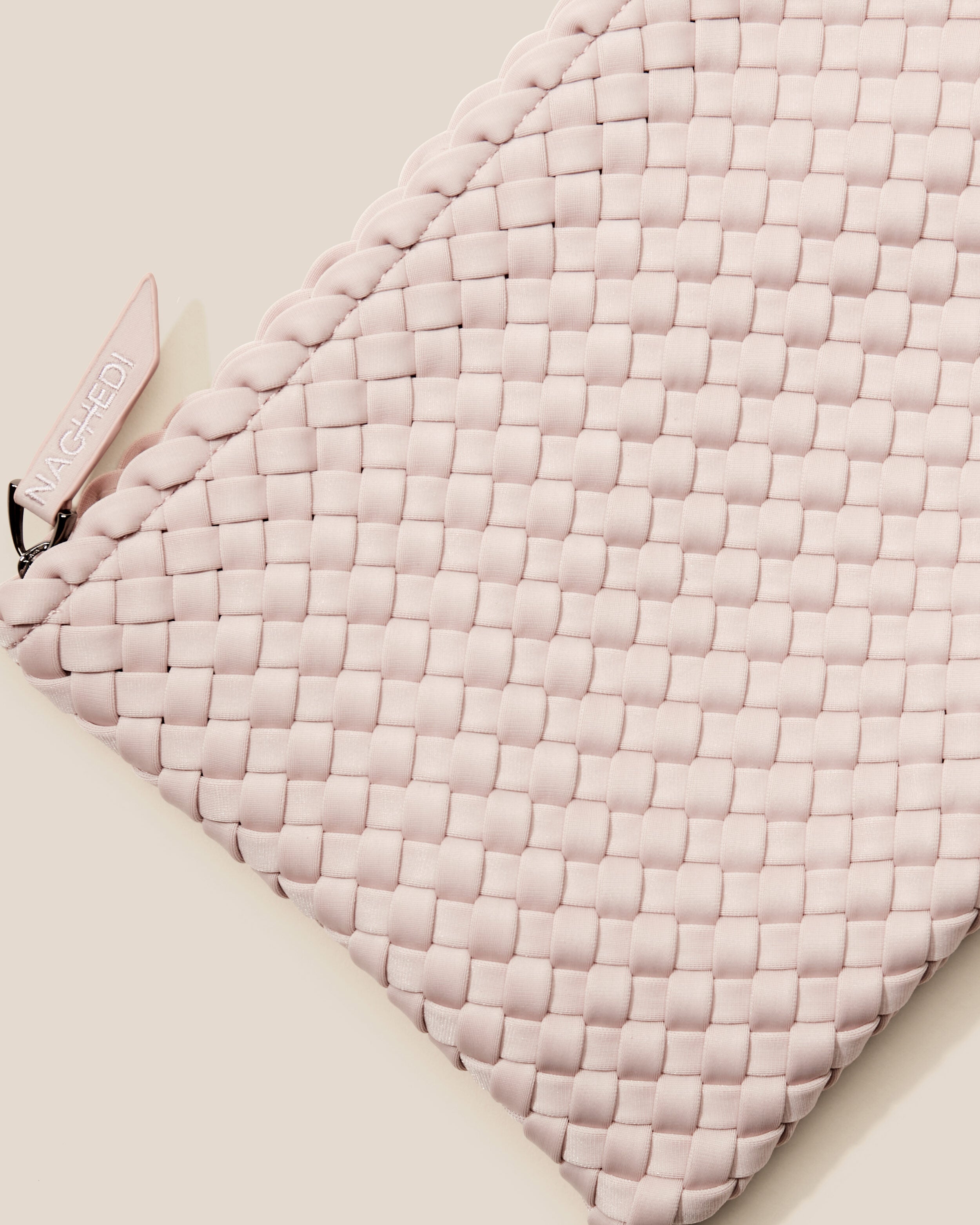 Close-up of included matching woven zippered pouch.