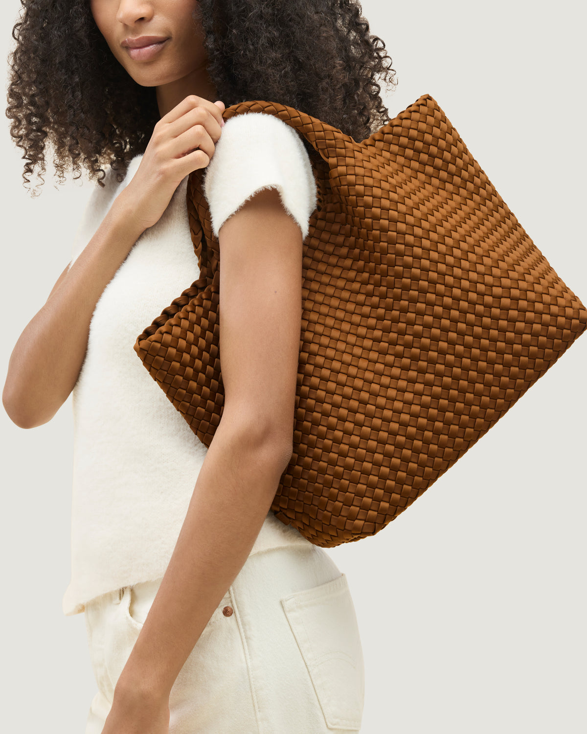 St. Barths Tote in Teak shown on model to illustrate scale and soft silhouette.