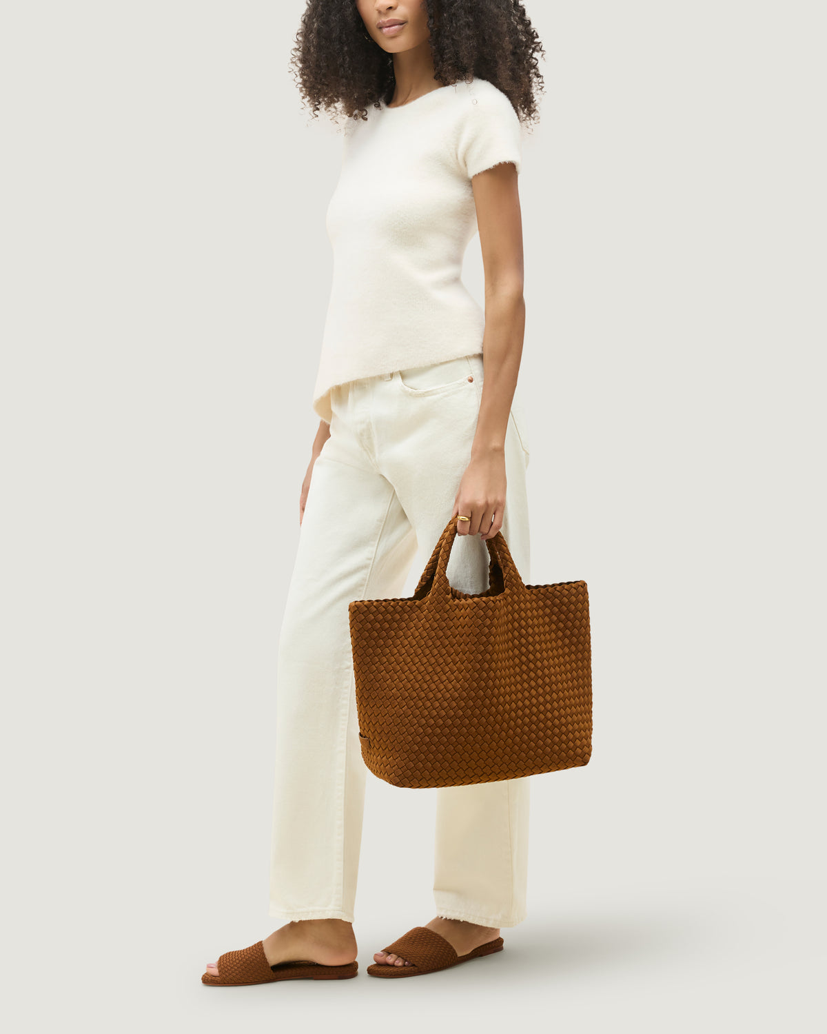 St. Barths Tote in Teak shown on model to illustrate scale and soft silhouette.