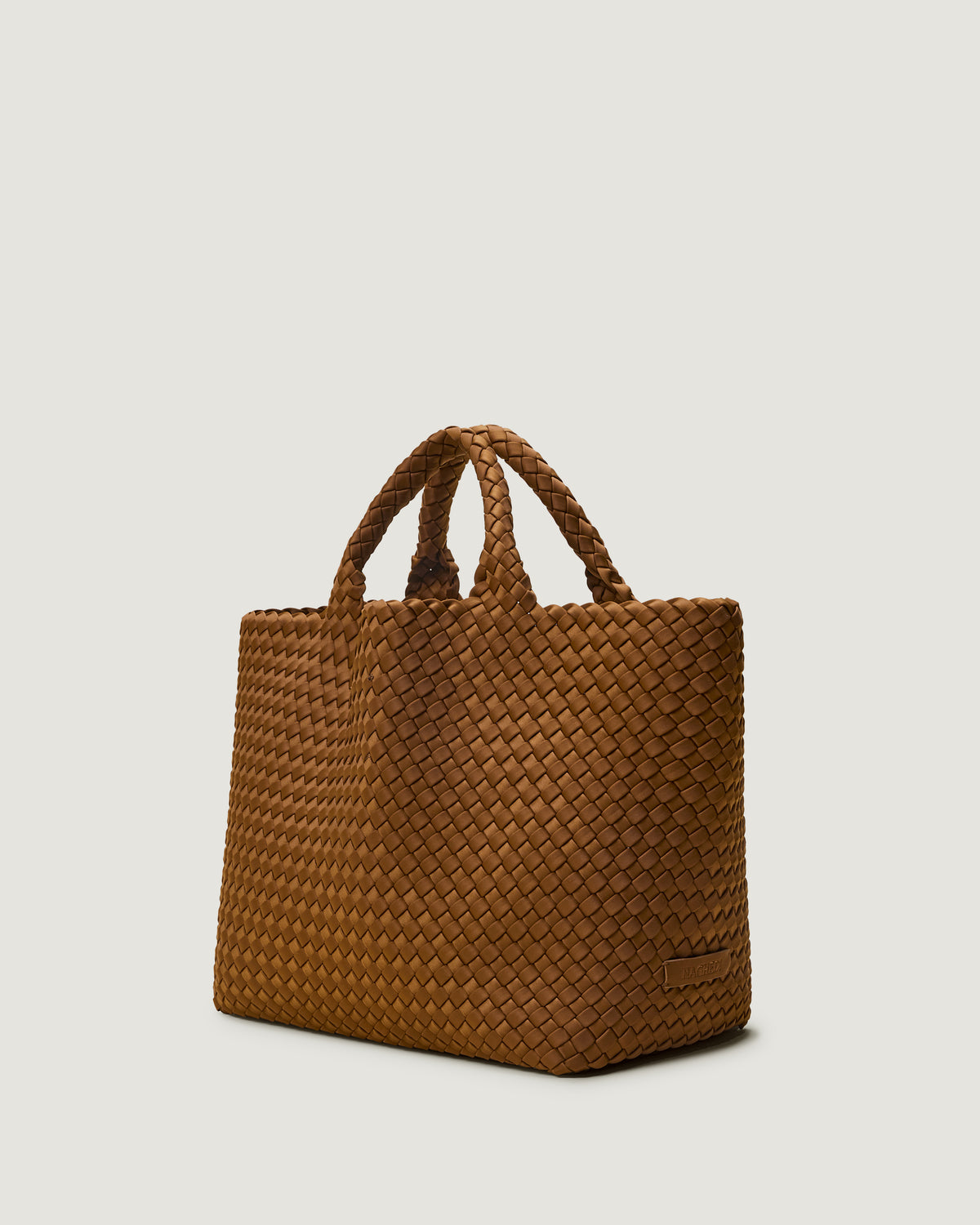 Side view of St. Barths medium tote in teak, a saddle brown tone