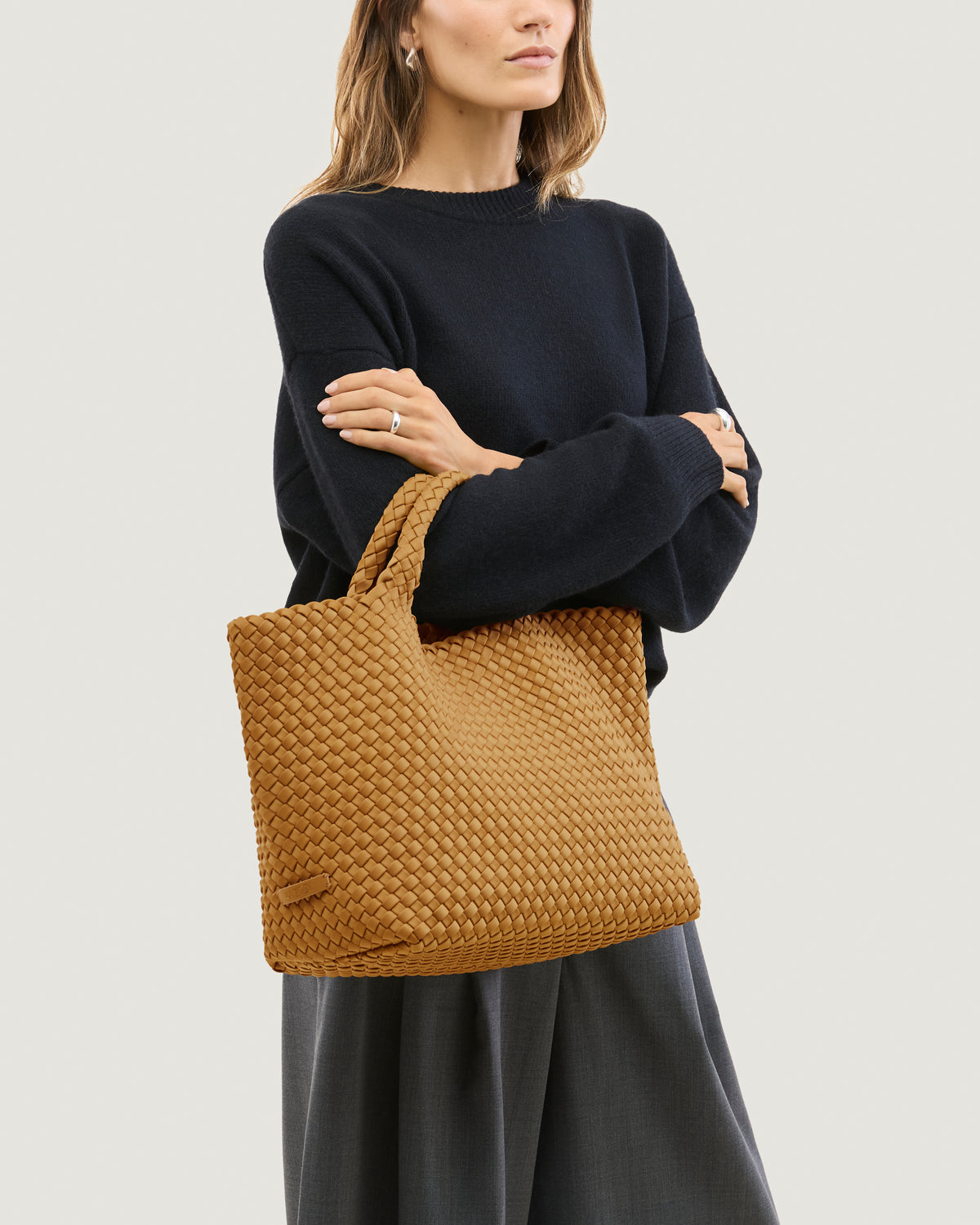 St. Barths Tote in Turmeric shown on model to illustrate scale and soft silhouette.