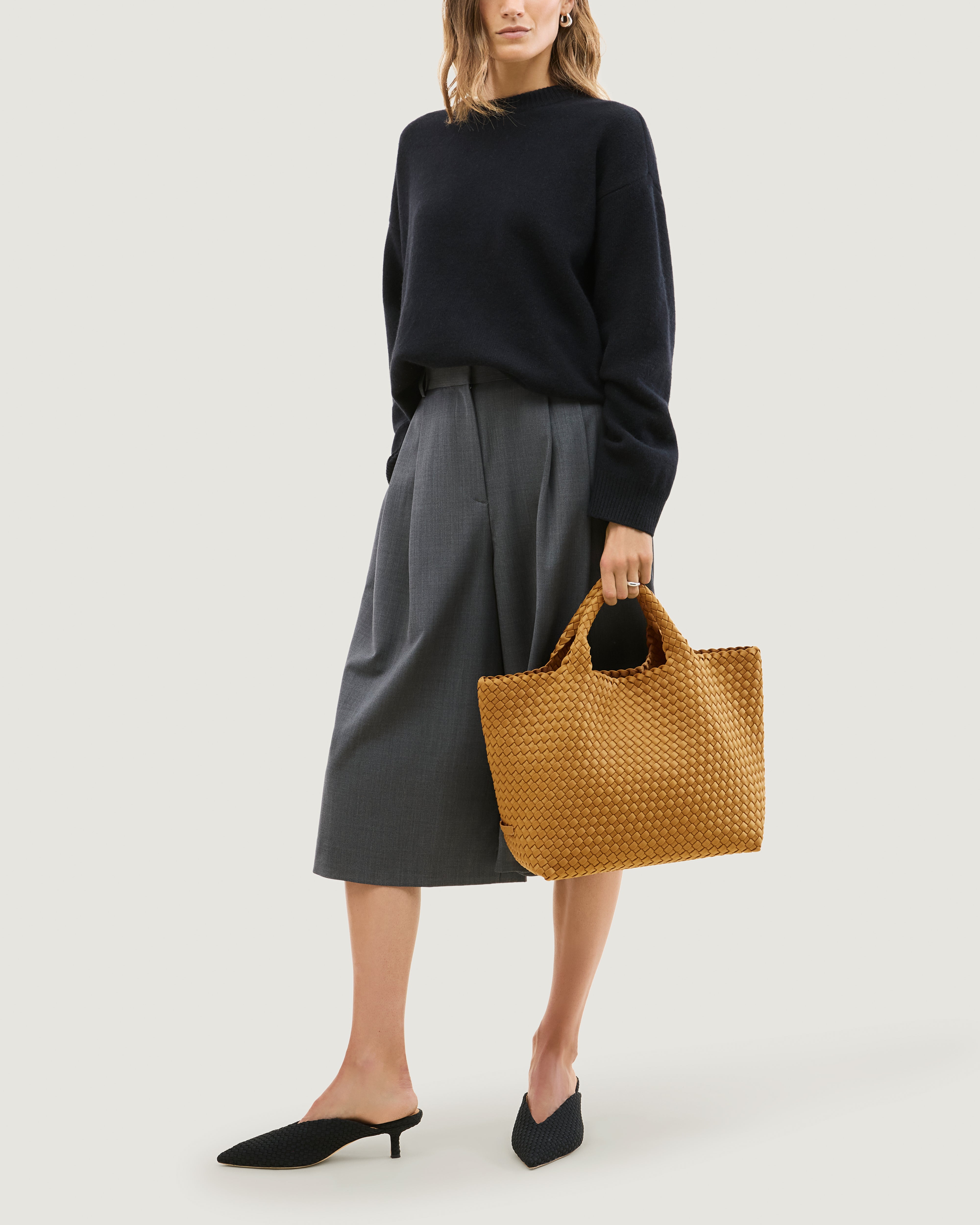 St. Barths Tote in Turmeric shown on model to illustrate scale and soft silhouette.