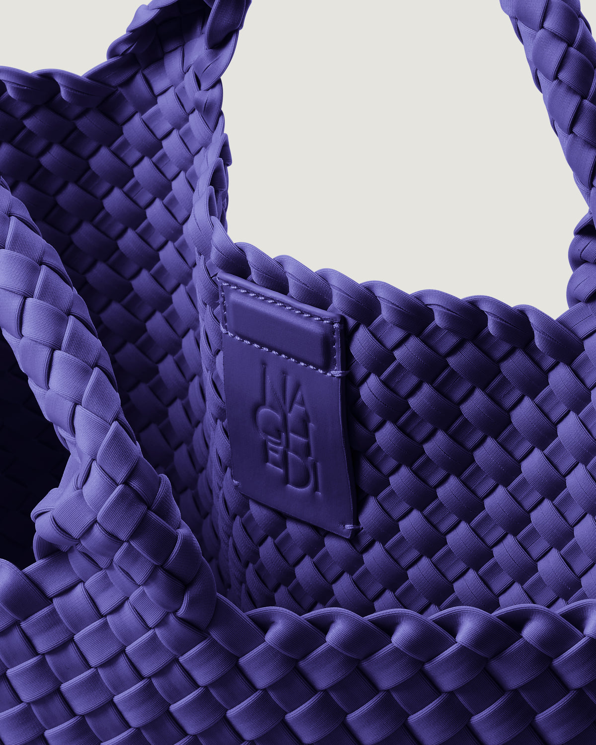 Interior close-up of St. Barths Tote in Ultramarine showing its magnetic snap closure, and unlined interior.