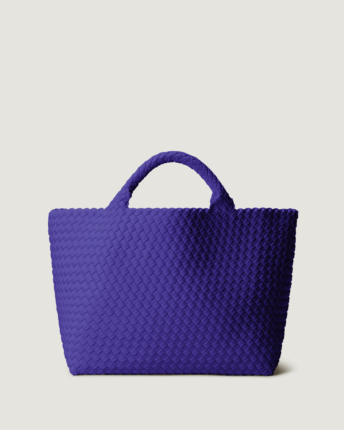 St. Barths Tote in Ultramarine in handwoven neoprene, featuring a magnetic closure, and woven top handles.
