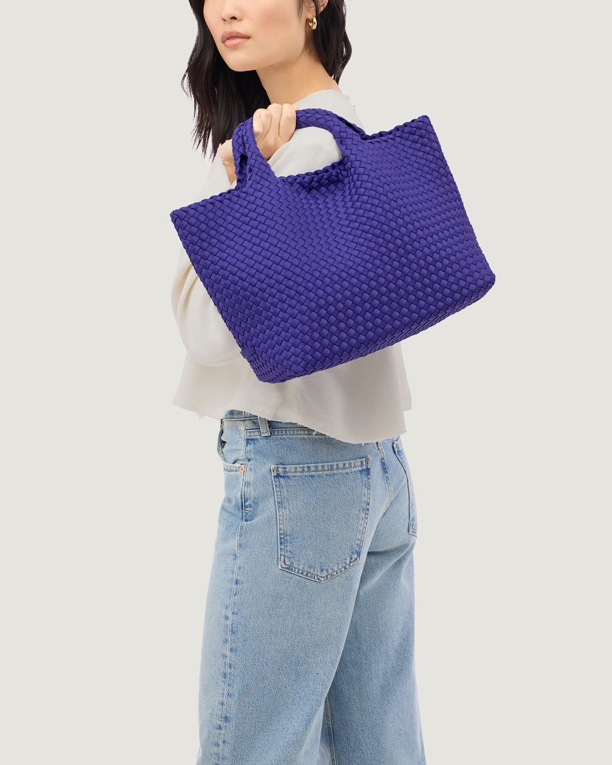 St. Barths Tote in Ultramarine shown on model to illustrate scale and soft silhouette.