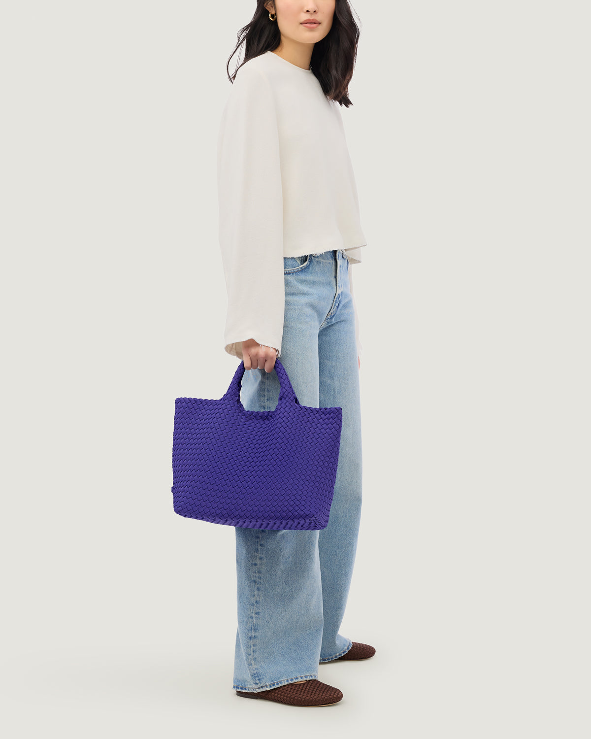 St. Barths Tote in Ultramarine shown on model to illustrate scale and soft silhouette.