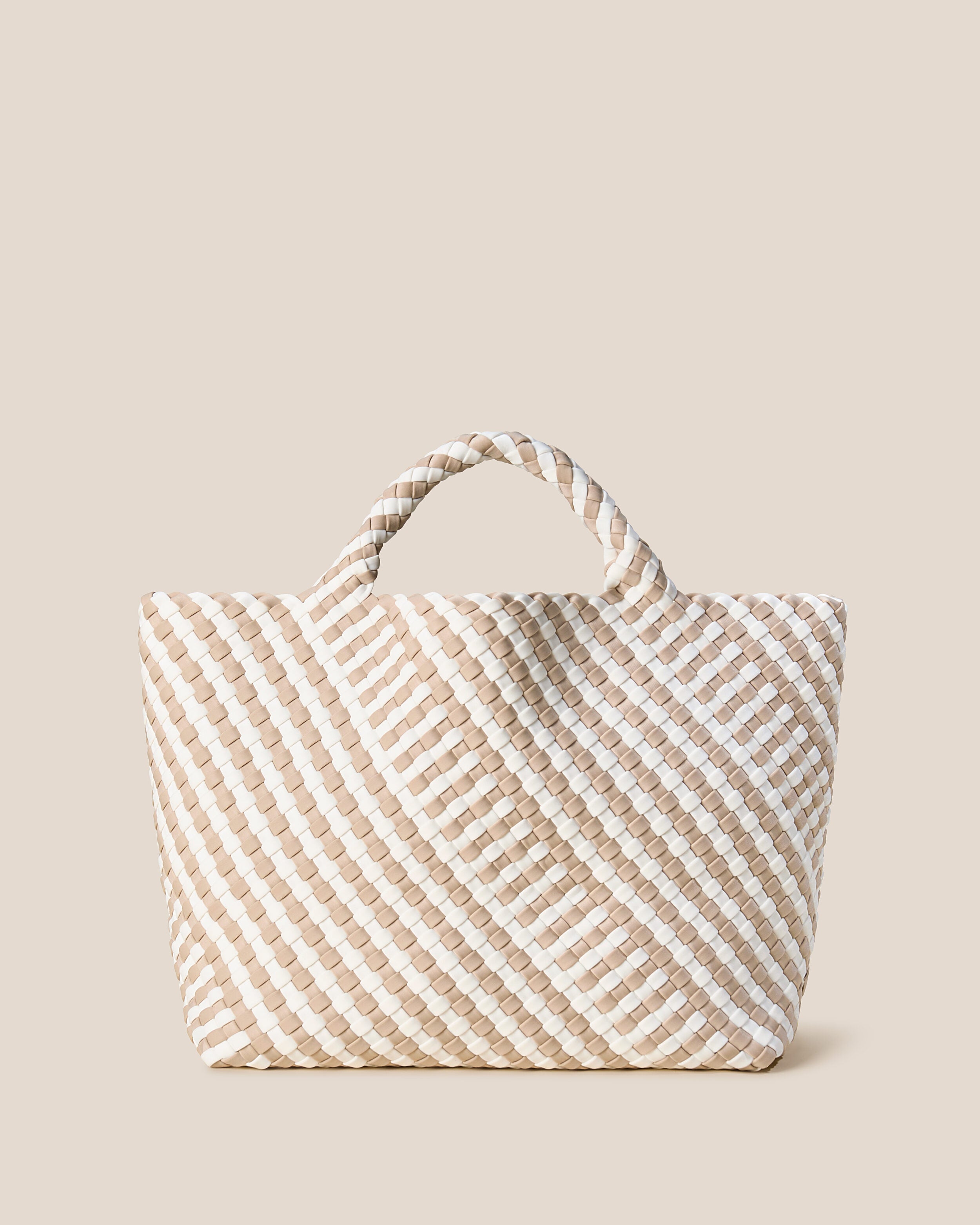 St. Barths Tote in Mykonos, a cream and ivory tone, in handwoven neoprene, featuring an open top, and woven top handles.