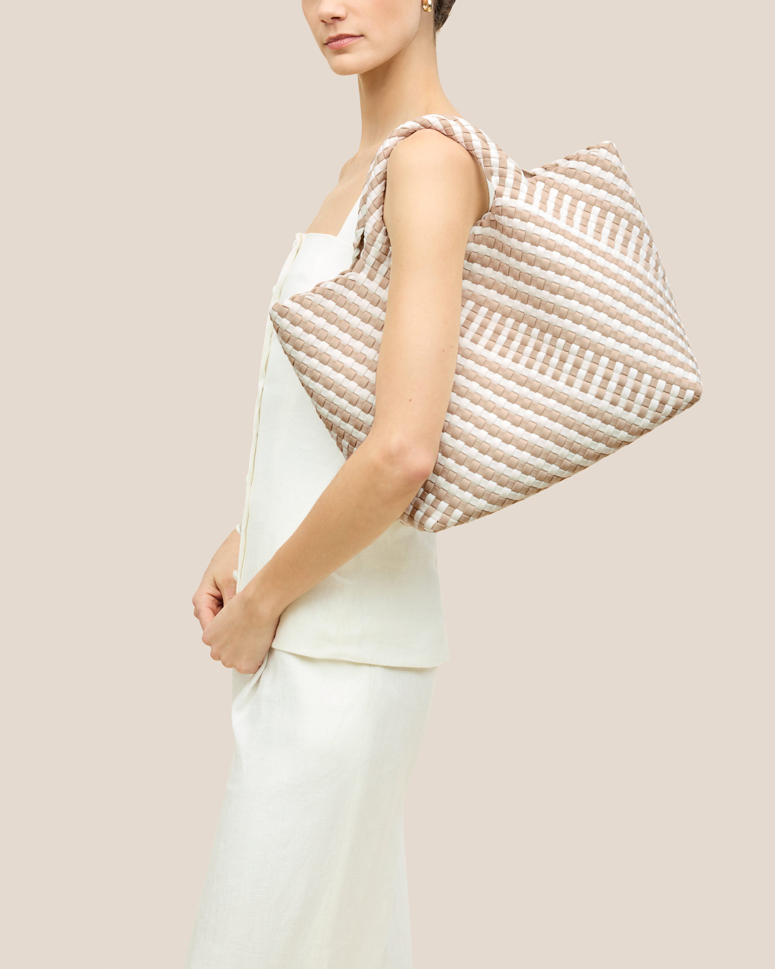 St. Barths Tote in Mykonos shown on model to illustrate scale and soft silhouette.