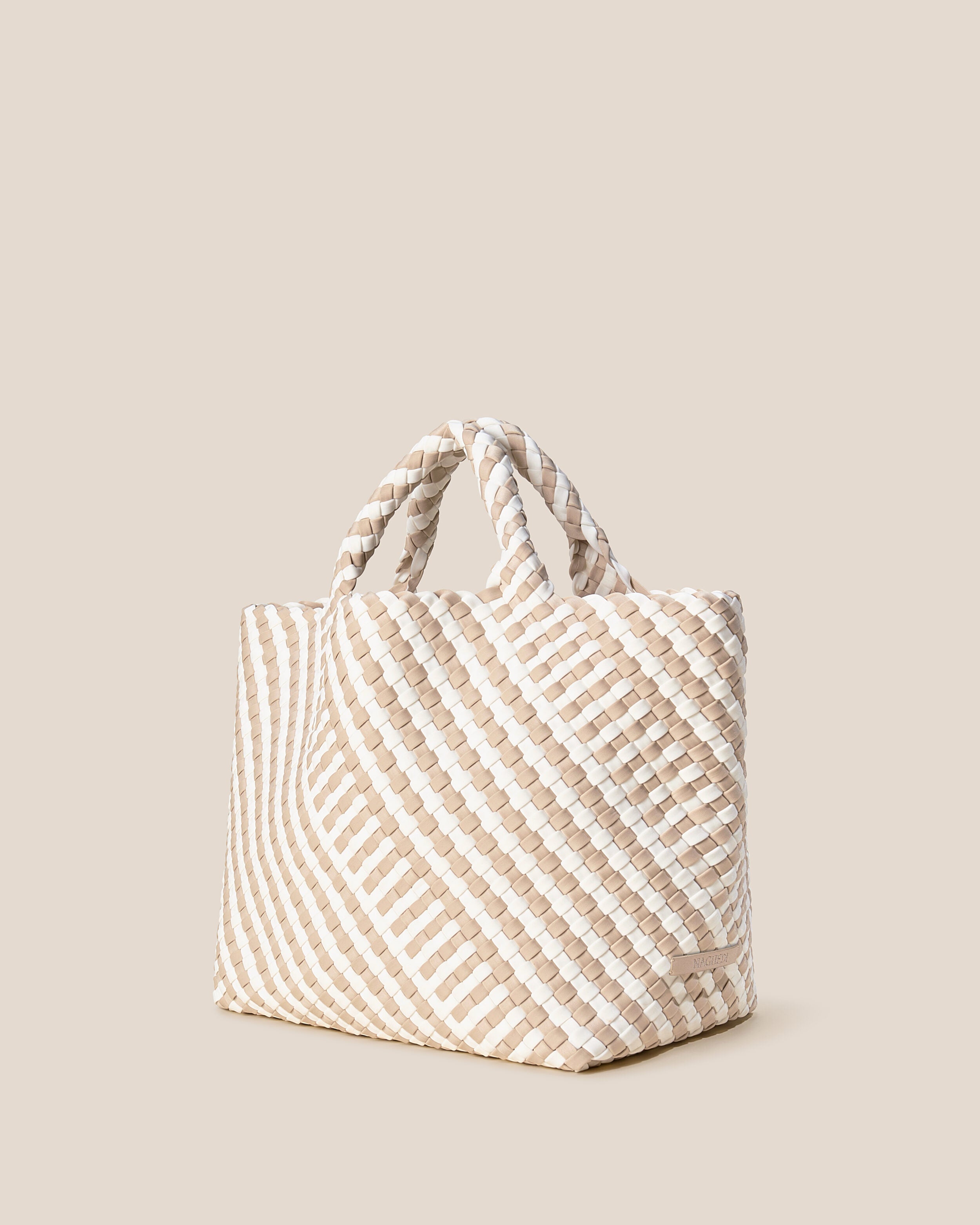 St. Barths Tote in Mykonos shown from a side angle, highlighting its handwoven neoprene construction and open top.