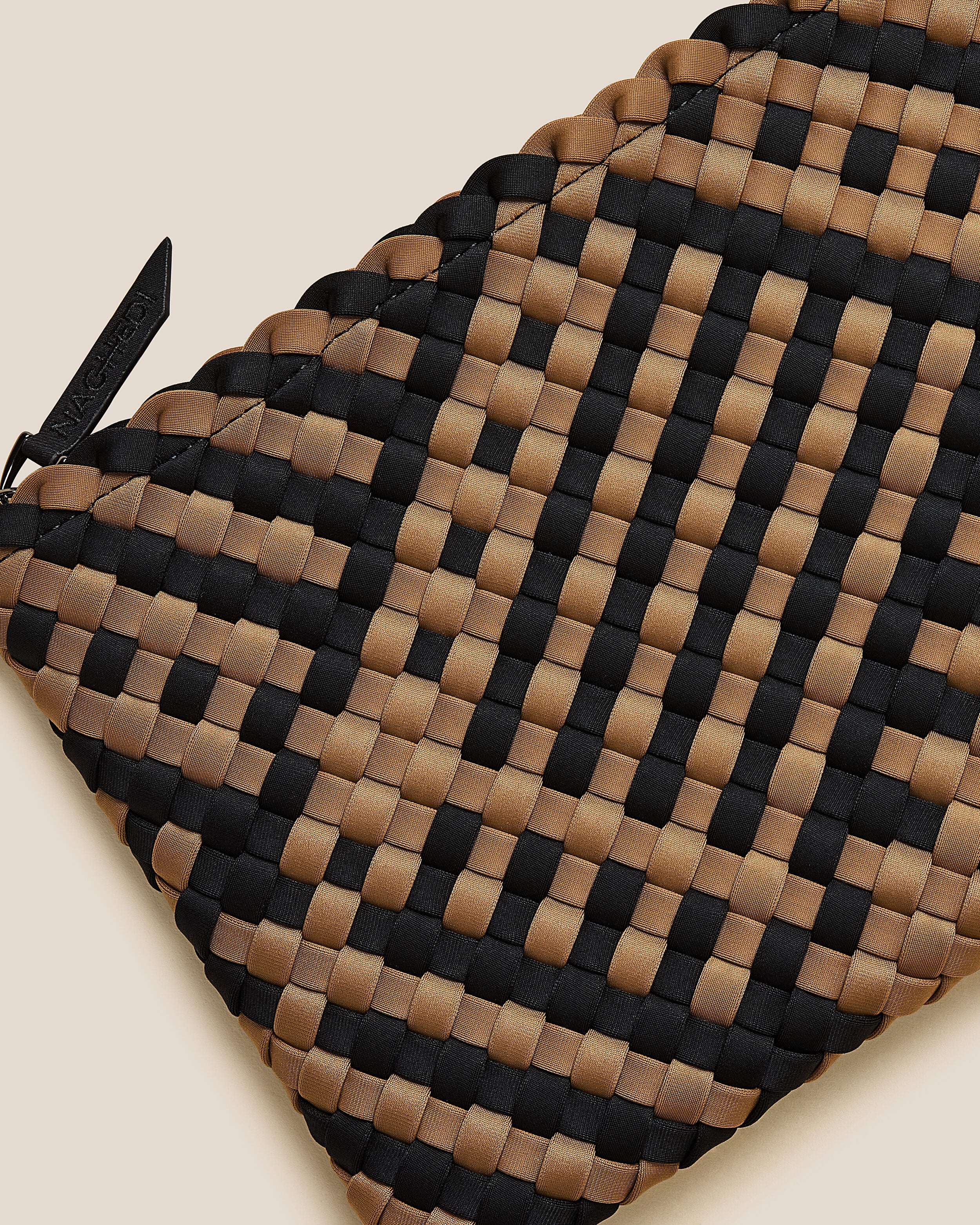 Close-up of included matching woven zippered pouch.