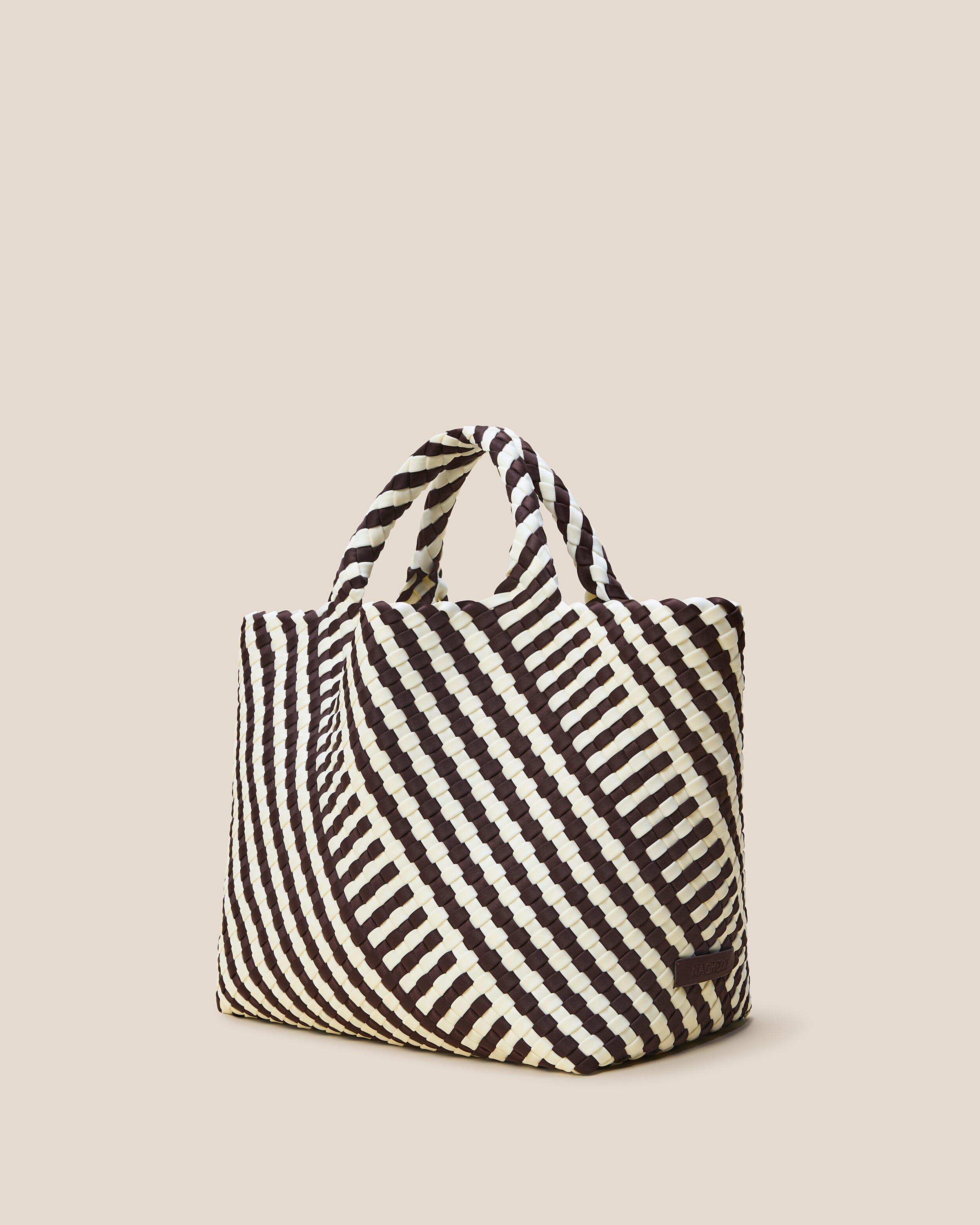 St. Barths Tote in Roma shown from a side angle, highlighting its handwoven neoprene construction and open top.