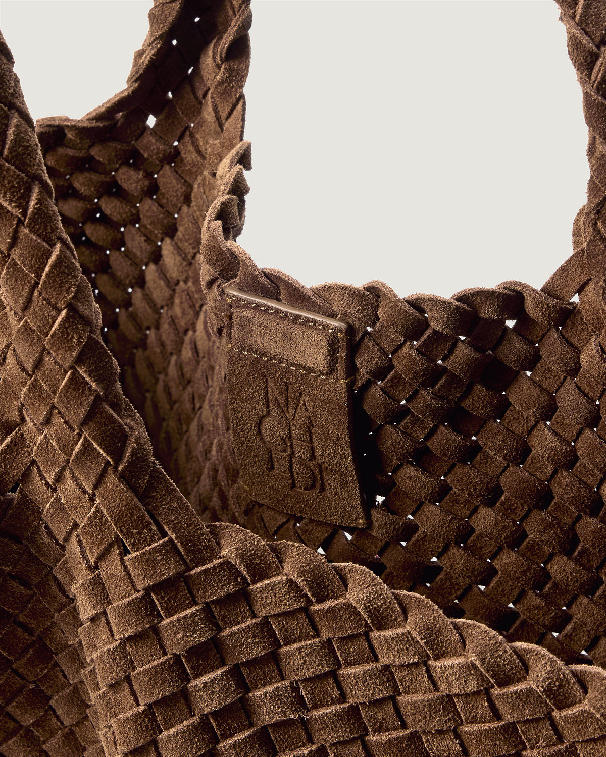 Interior close-up of St. Barths Tote in Teak showing its magnetic snap closure, and unlined interior.