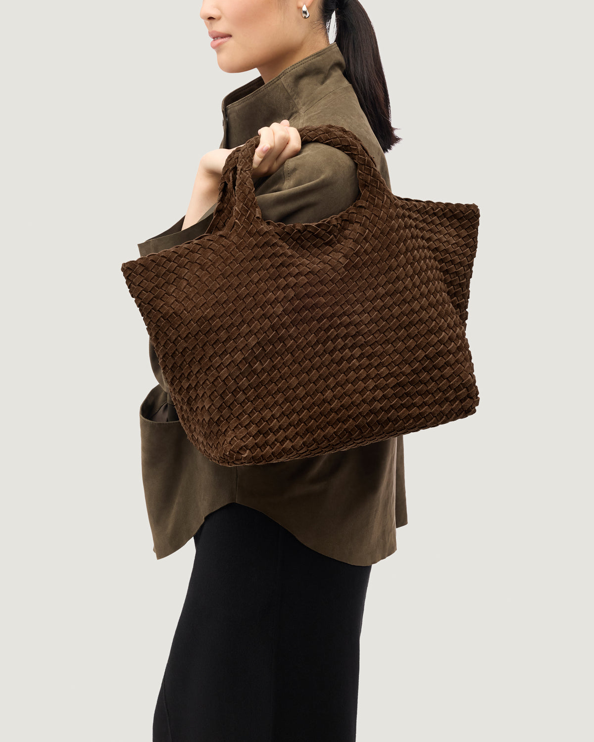 St. Barths Tote in Teak shown on model to illustrate scale and soft silhouette.