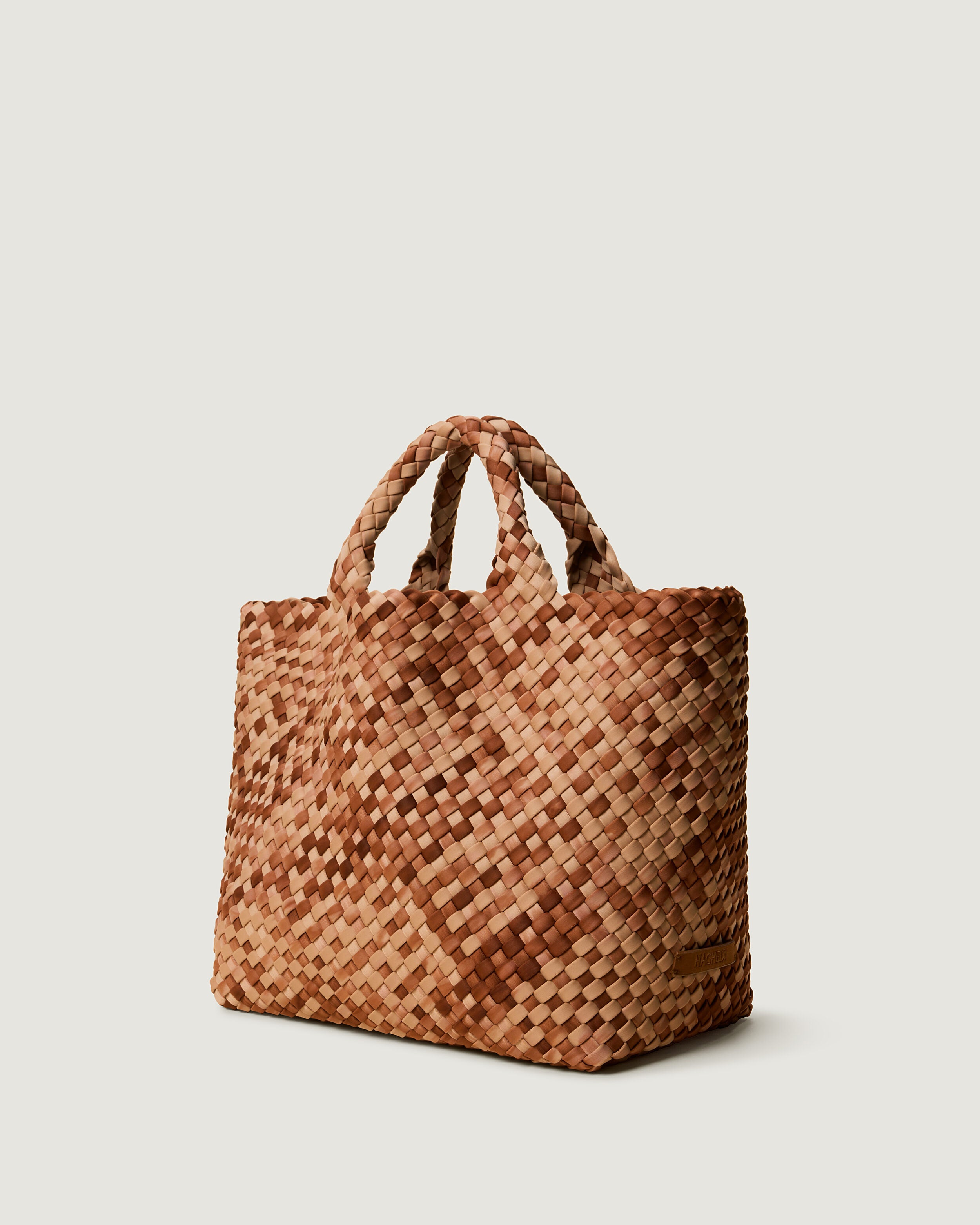 St. Barths Tote in Fez shown from a side angle, highlighting its handwoven neoprene construction and open top.