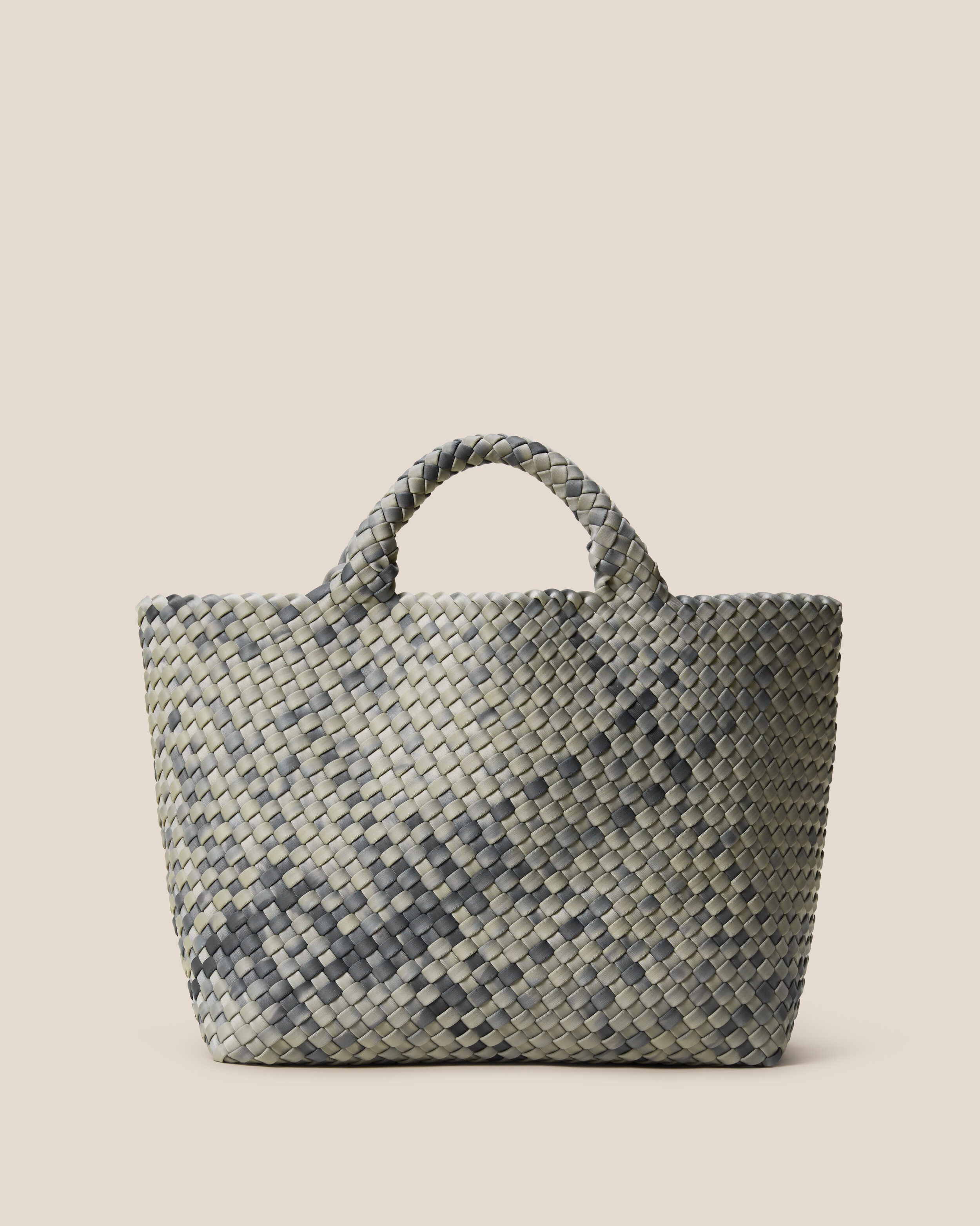 St. Barths Tote in Neptune, a gray and and navy tone, in handwoven neoprene, featuring an open top, and woven top handles.