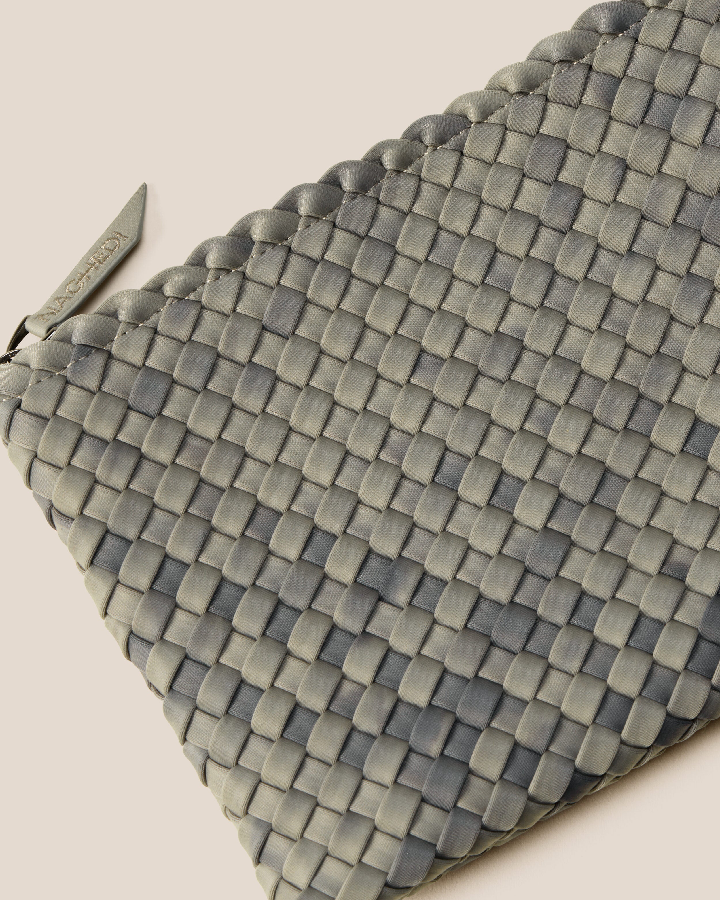 Close-up of included matching woven zippered pouch.