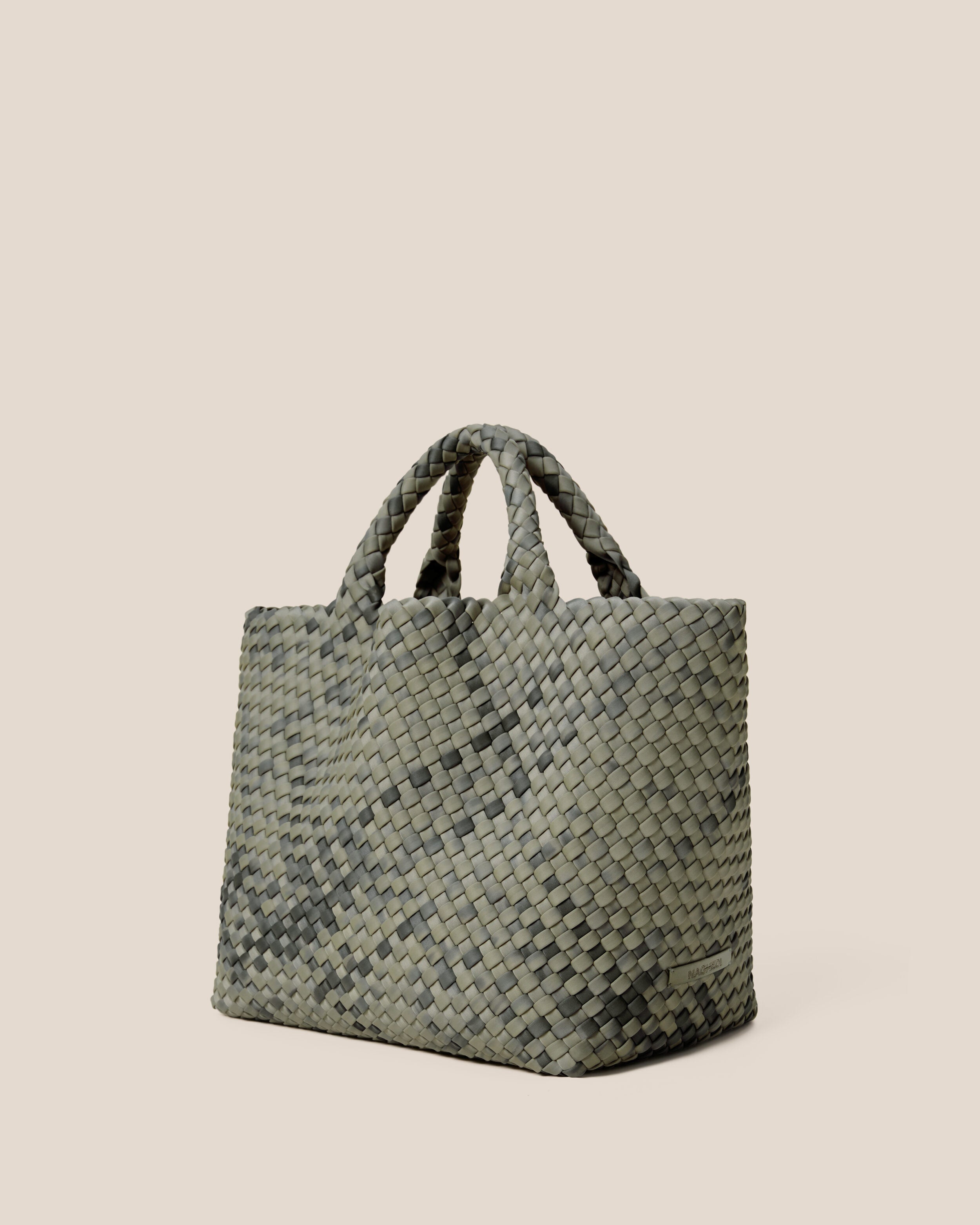 St. Barths Tote in Neptune shown from a side angle, highlighting its handwoven neoprene construction and open top.