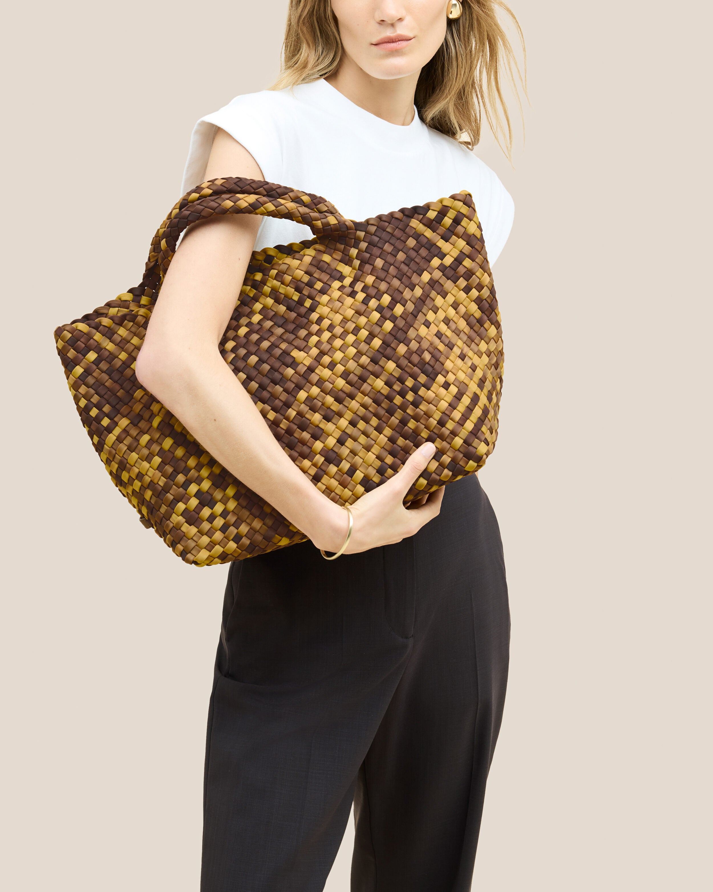St. Barths Tote in Tortoiseshell shown on model to illustrate scale and soft silhouette.