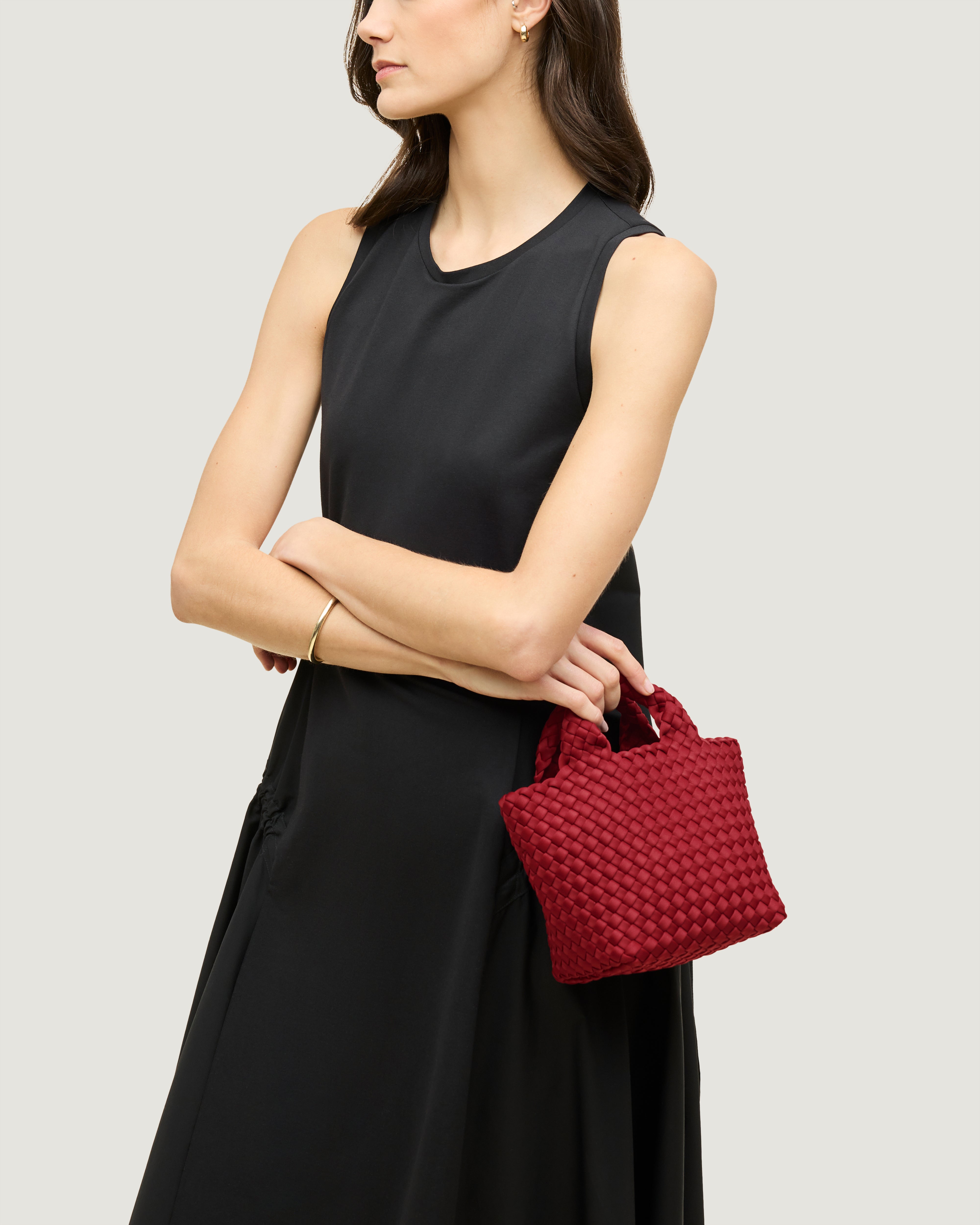 St. Barths Tote in Rosso shown on model to illustrate scale and soft silhouette.