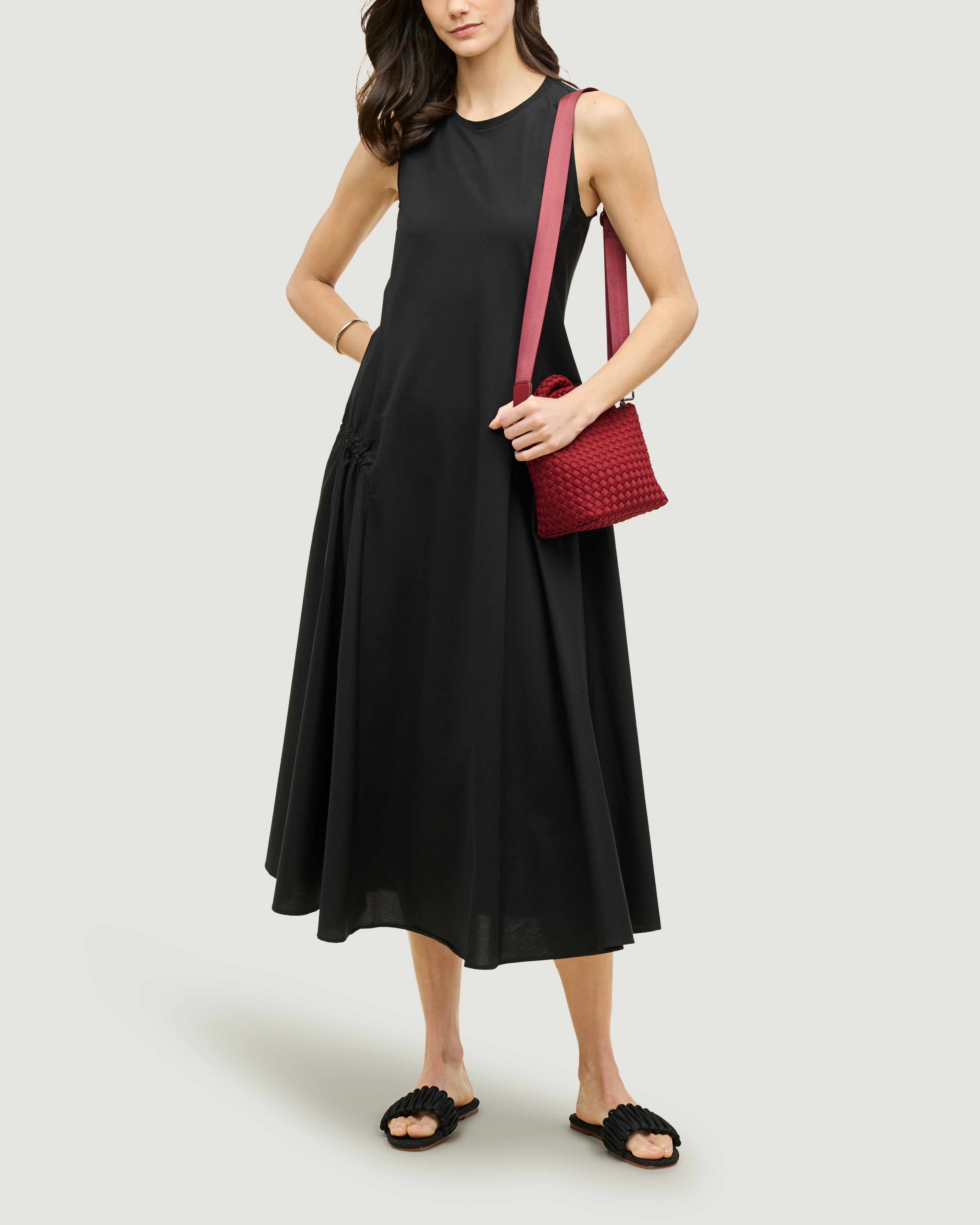 St. Barths Tote in Rosso shown on model to illustrate scale and soft silhouette.