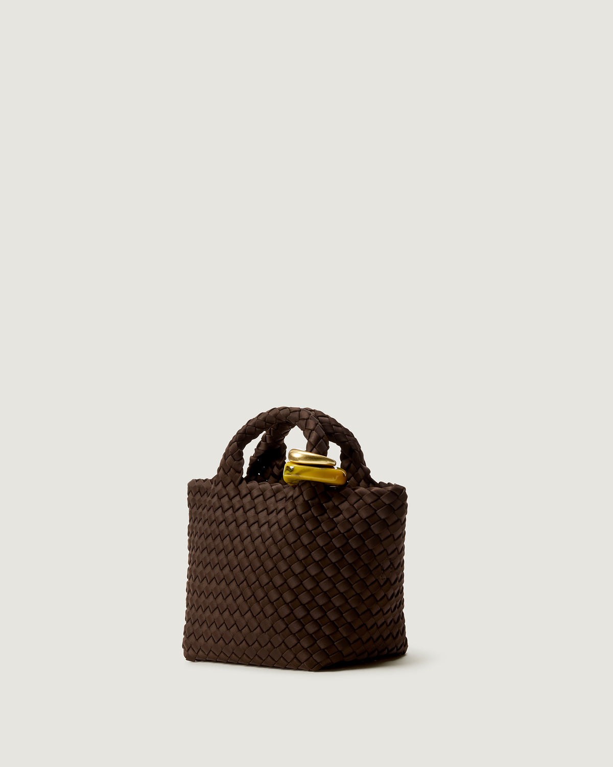 Side view of St Barths Petit Tote in Chocolate showcasing open top, handwoven neoprene structure, and structural bead ornaments.