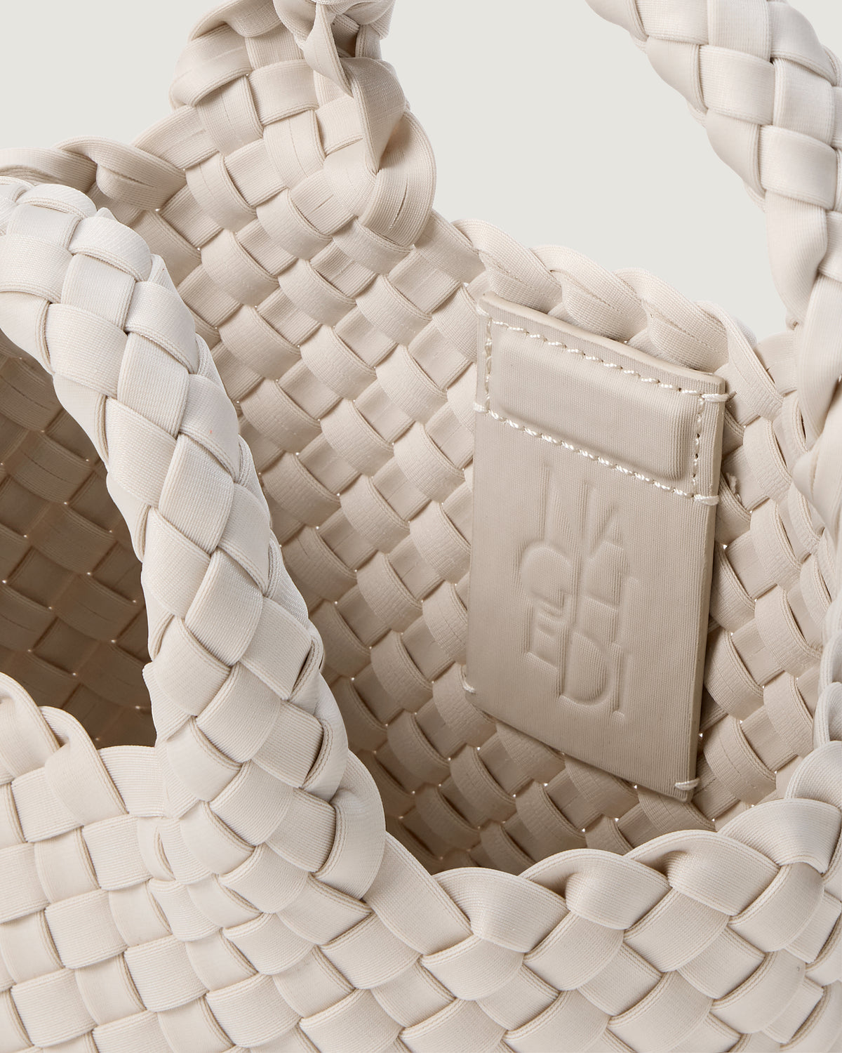 Interior close up of St Barths Tote in Linen showing open top, unlined interior, and magnetic closure.