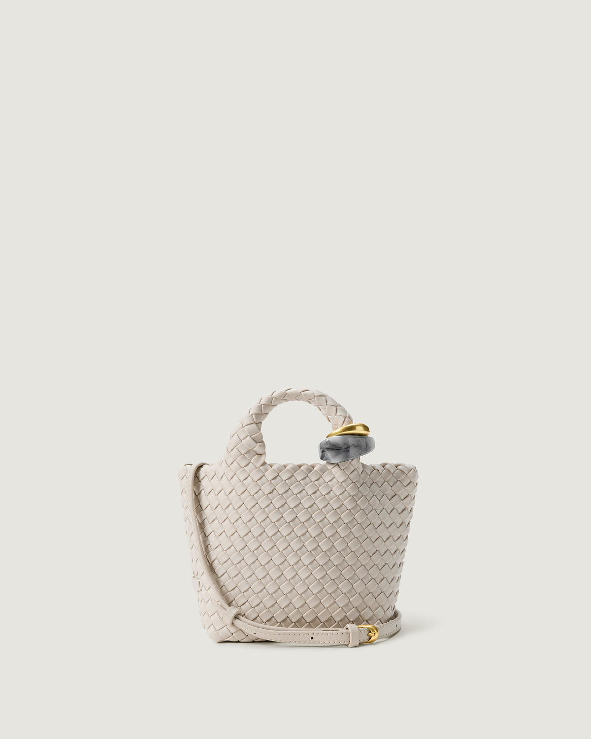 St. Barths Tote in Linen, an ivory tone, in handwoven neoprene, featuring an open top, beads on front handle, and leather strap.