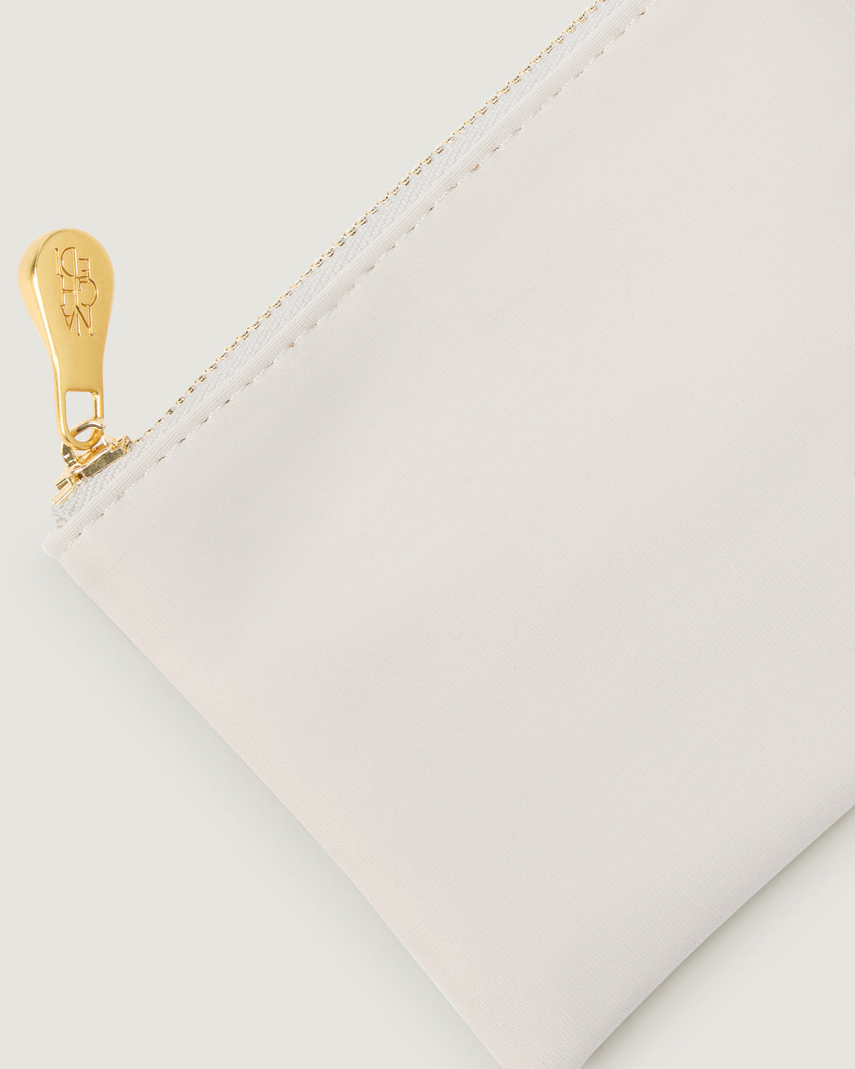 Close-up of included corresponding zippered pouch.