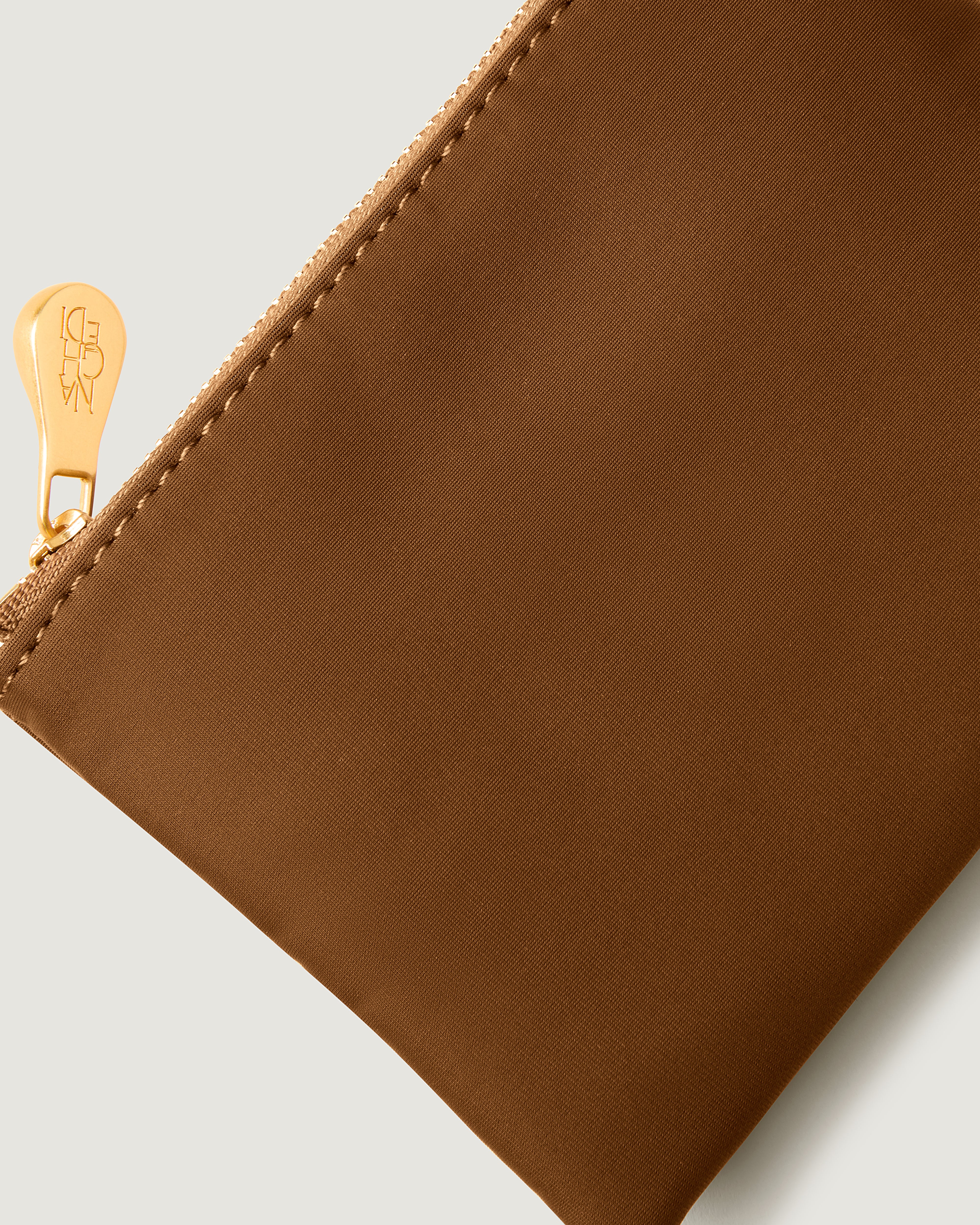 Close-up of included corresponding zippered pouch.