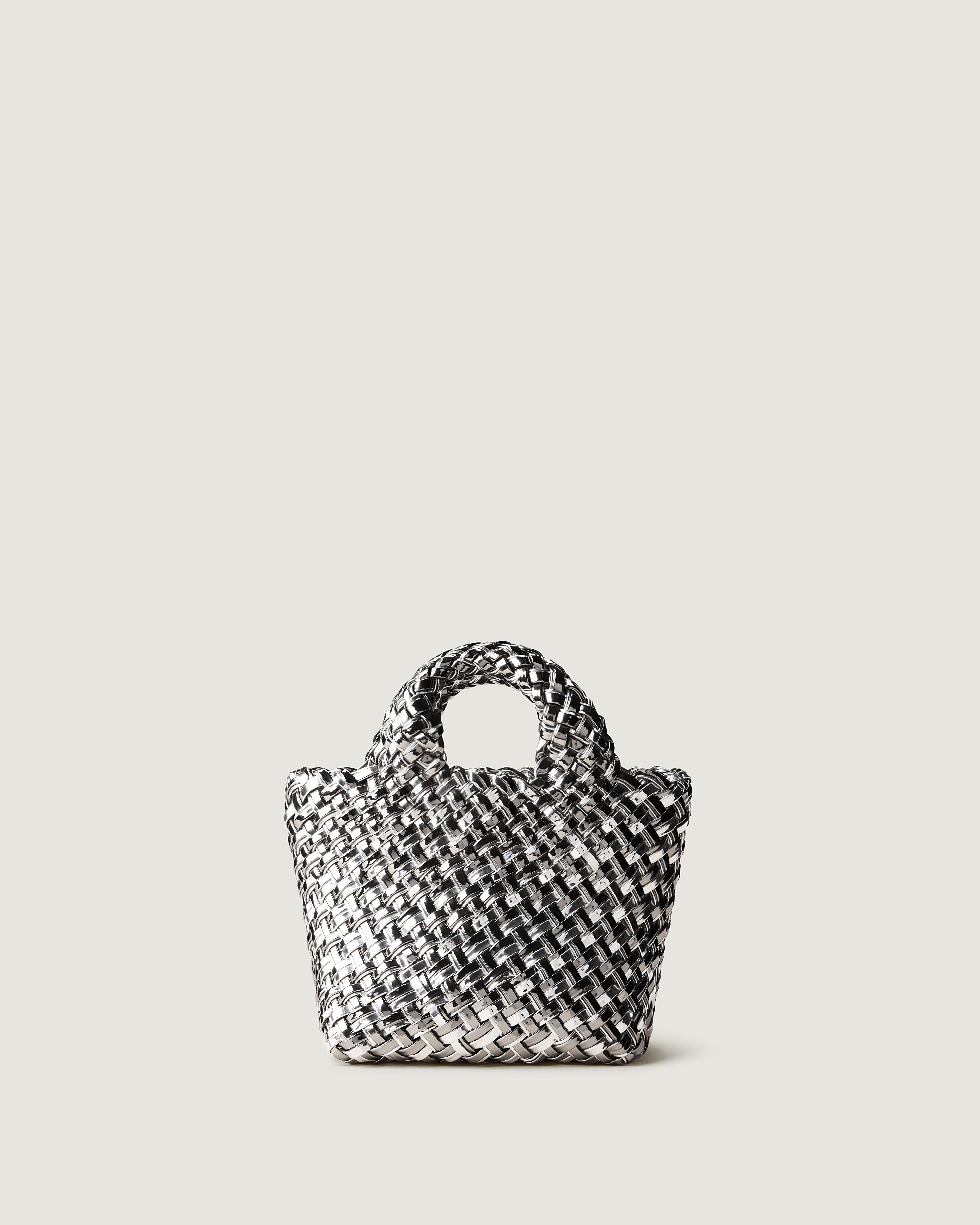 St. Barths Tote in Pewter, in handwoven metallic-coated nylon, featuring an open top, and woven top handles.