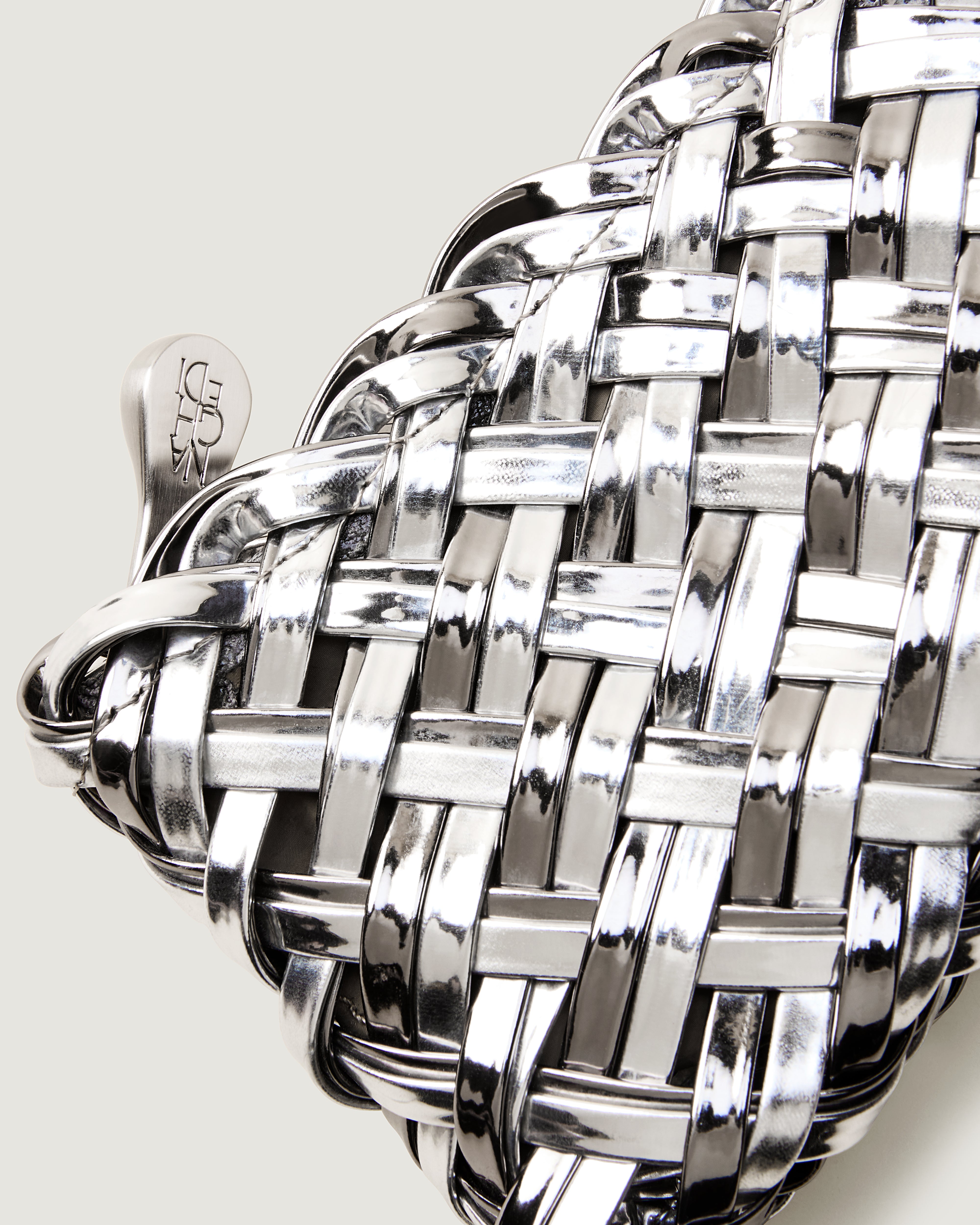 Close-up of included matching metallic-coated nylon zippered pouch.