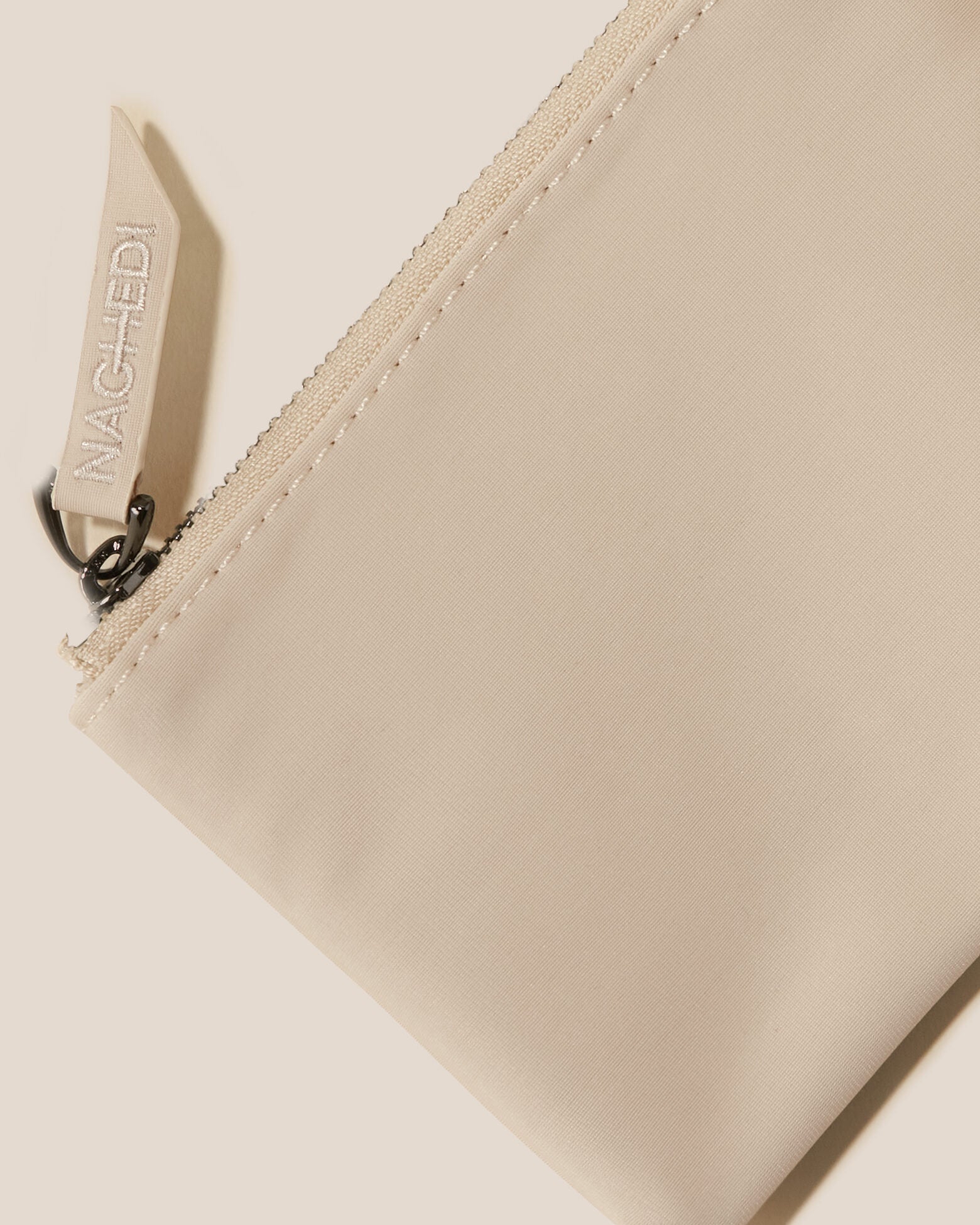 Close-up of included coordinating neoprene zippered pouch.