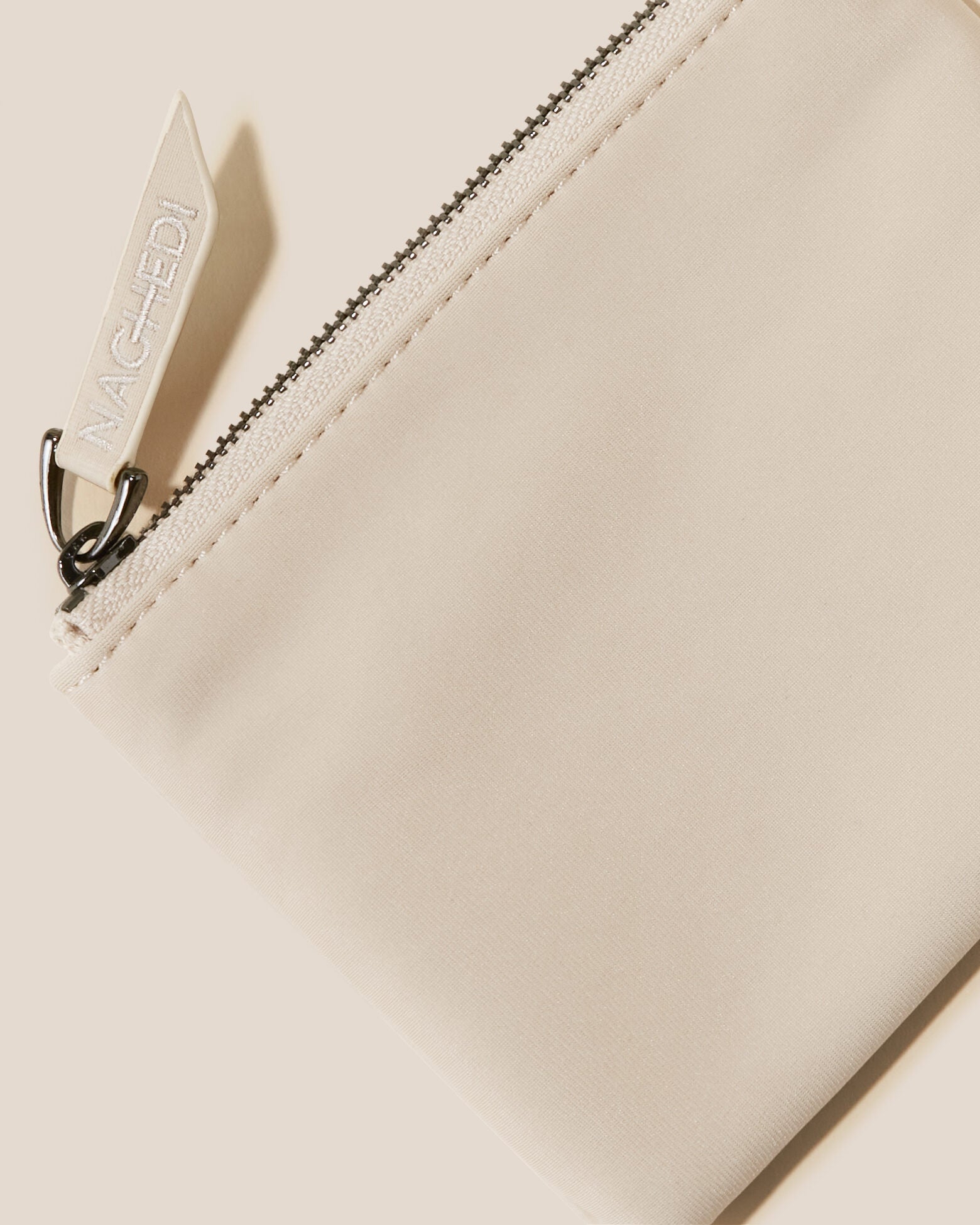 Close-up of included coordinating neoprene zippered pouch.