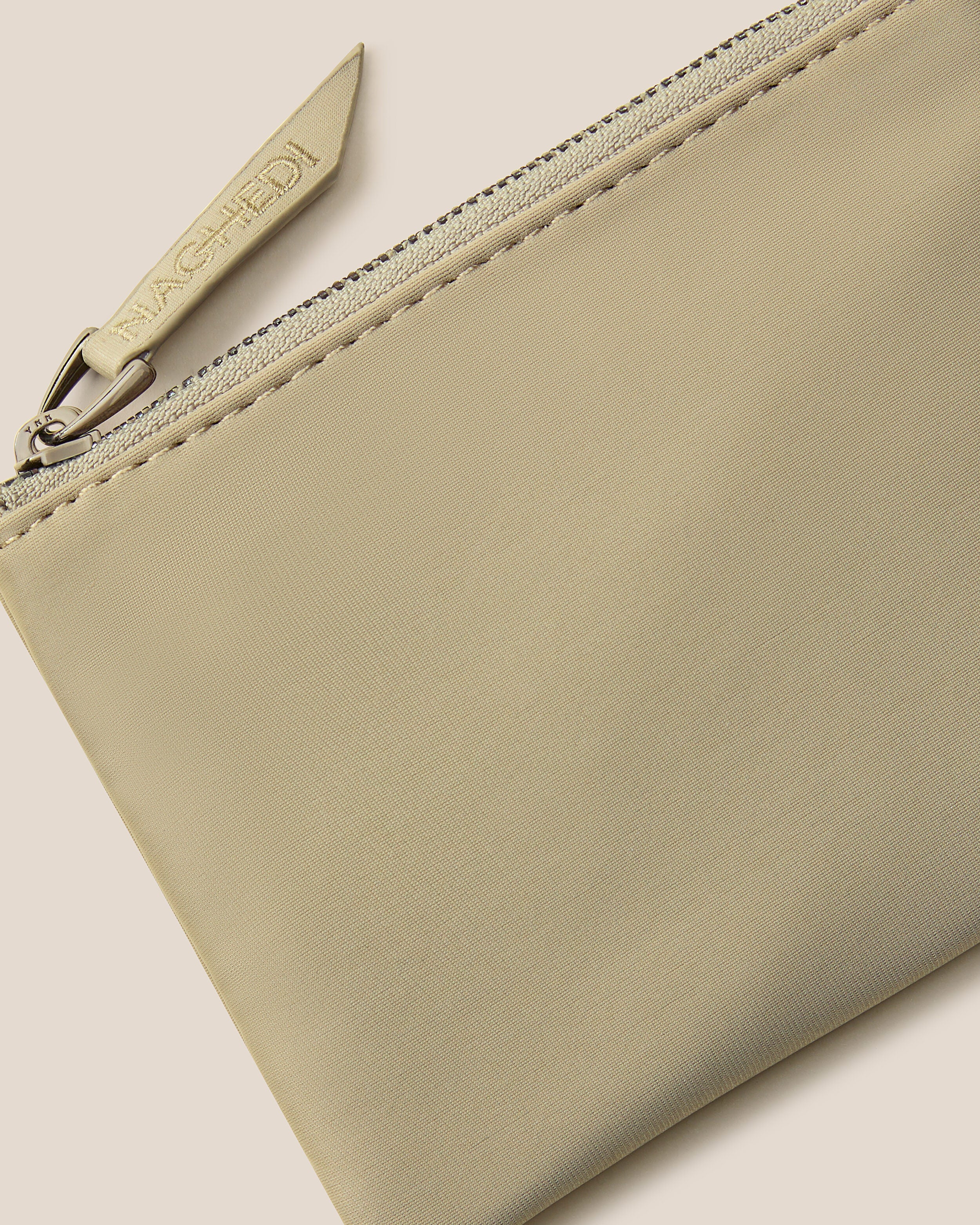 Close-up of included coordinating neoprene zippered pouch.