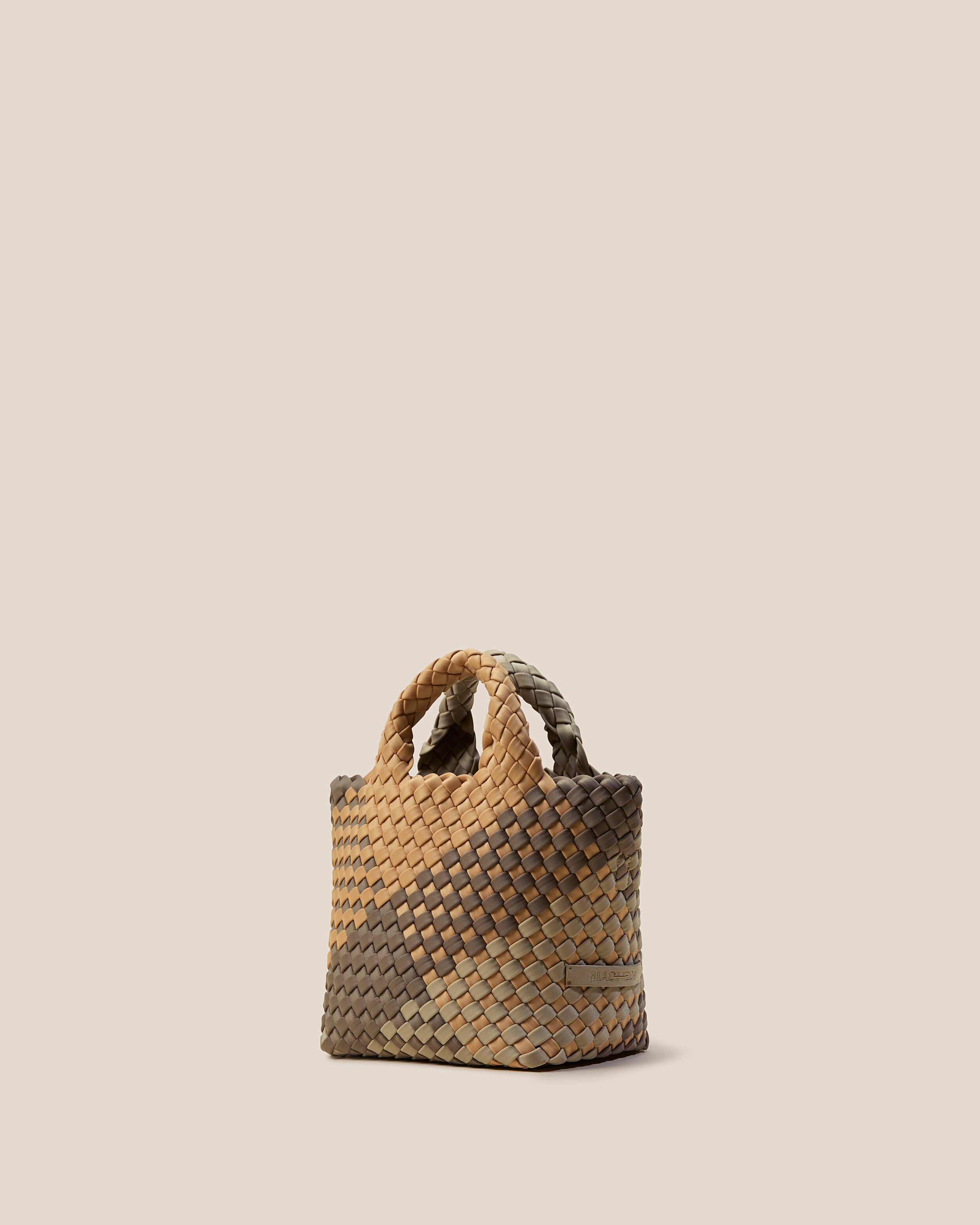 St. Barths Tote in Melbourne shown from a side angle, highlighting its handwoven neoprene construction and open top.