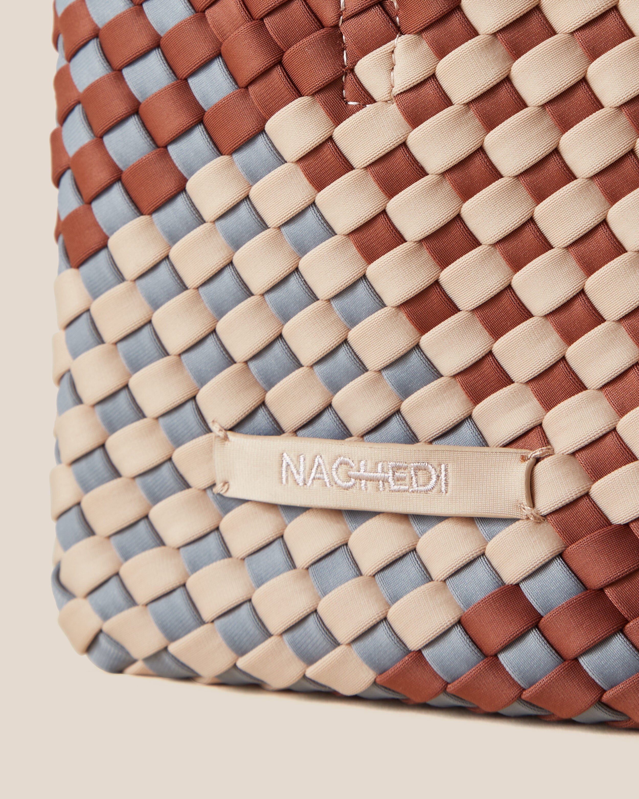 Close-up of stamped NAGHEDI logo on St. Barths Tote in Taos.