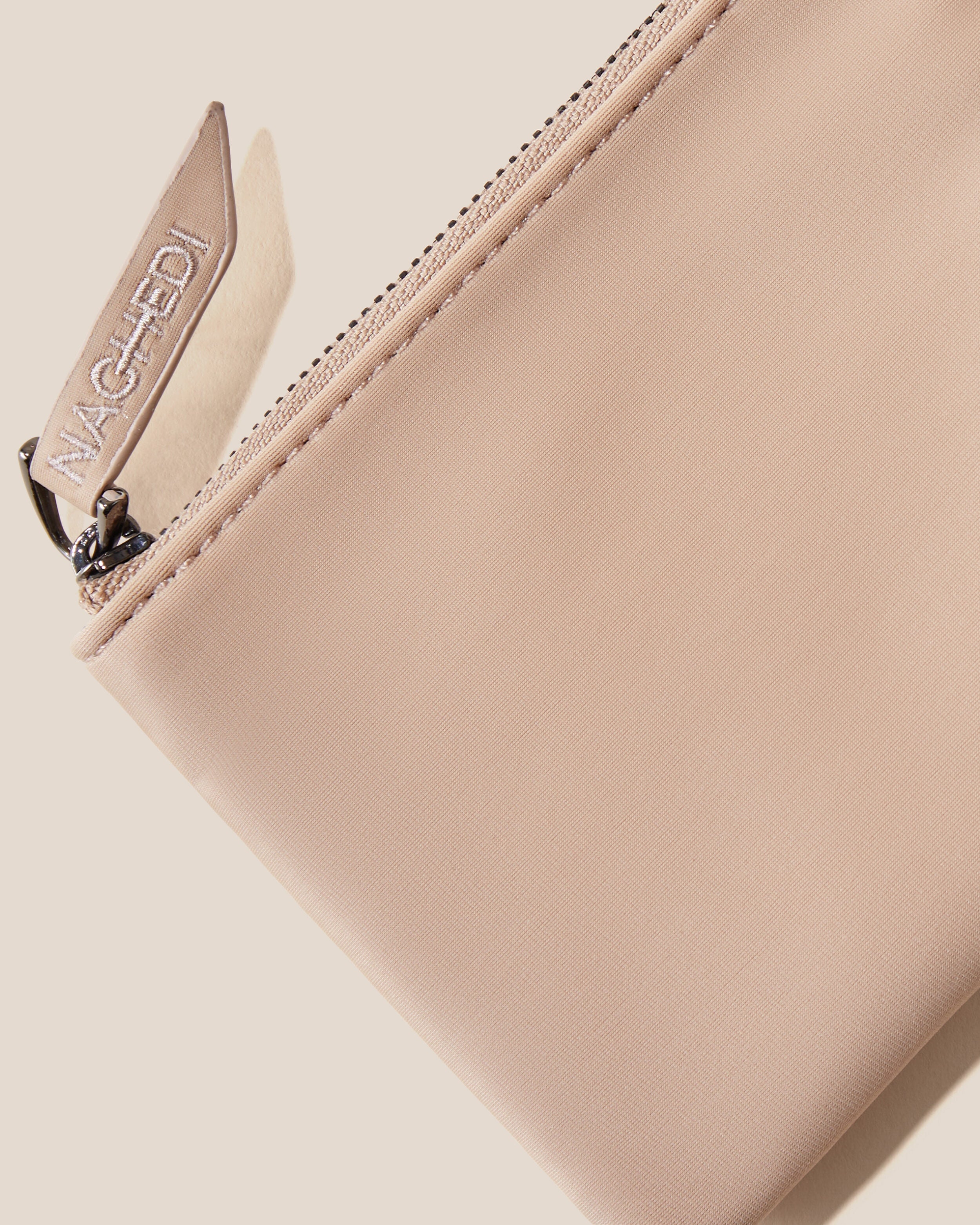 Close-up of included coordinating neoprene zippered pouch.