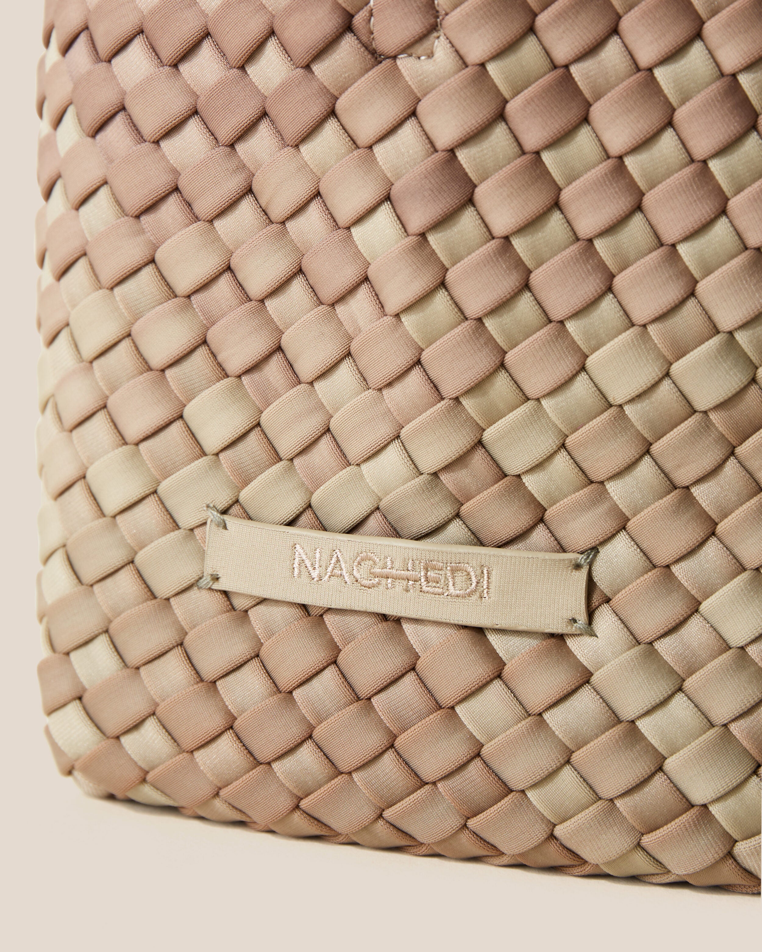 Close-up of stamped NAGHEDI logo on St. Barths Tote in Bronzed.