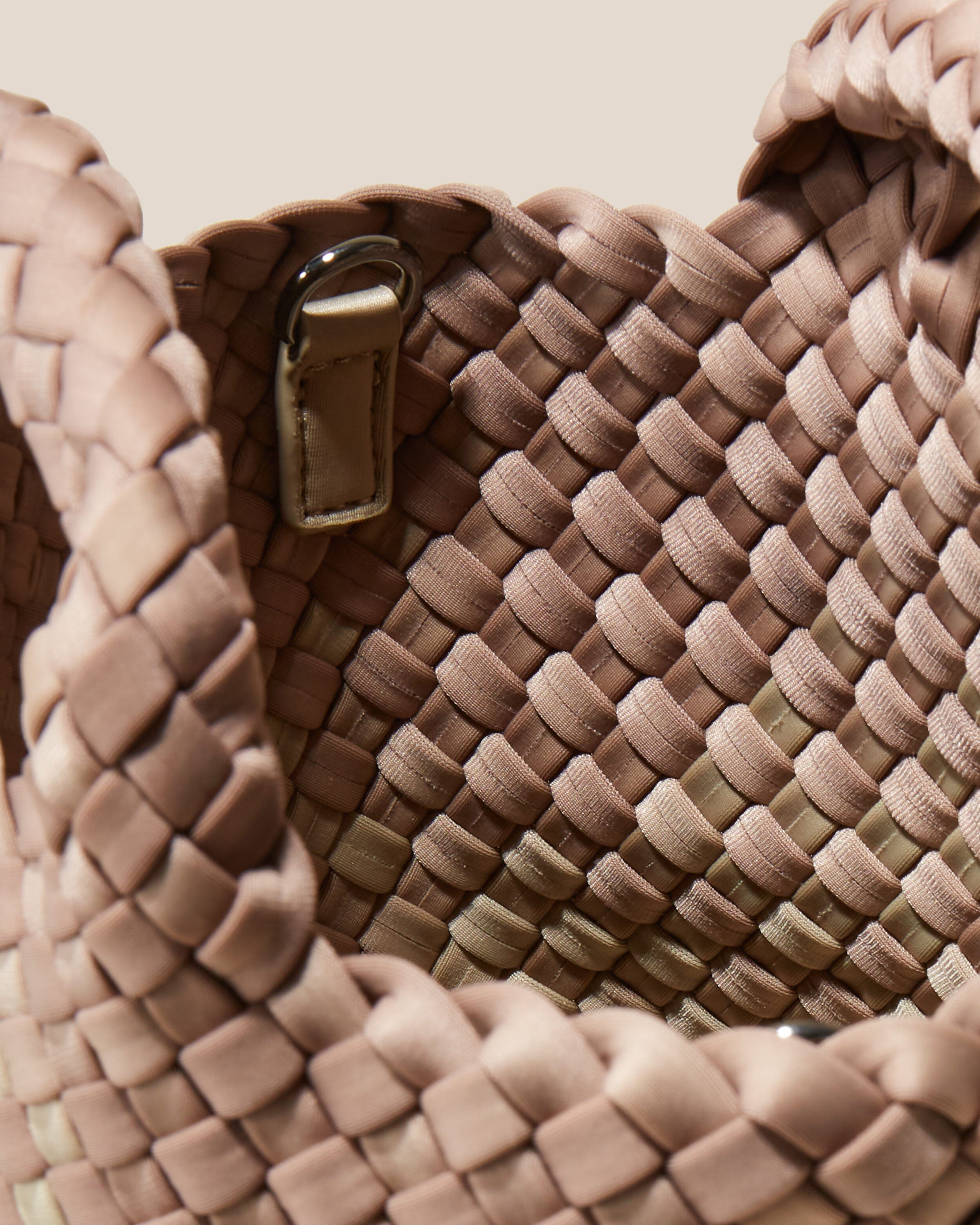 Interior close-up of St. Barths Tote in Bronzed showing its open top, and unlined interior.