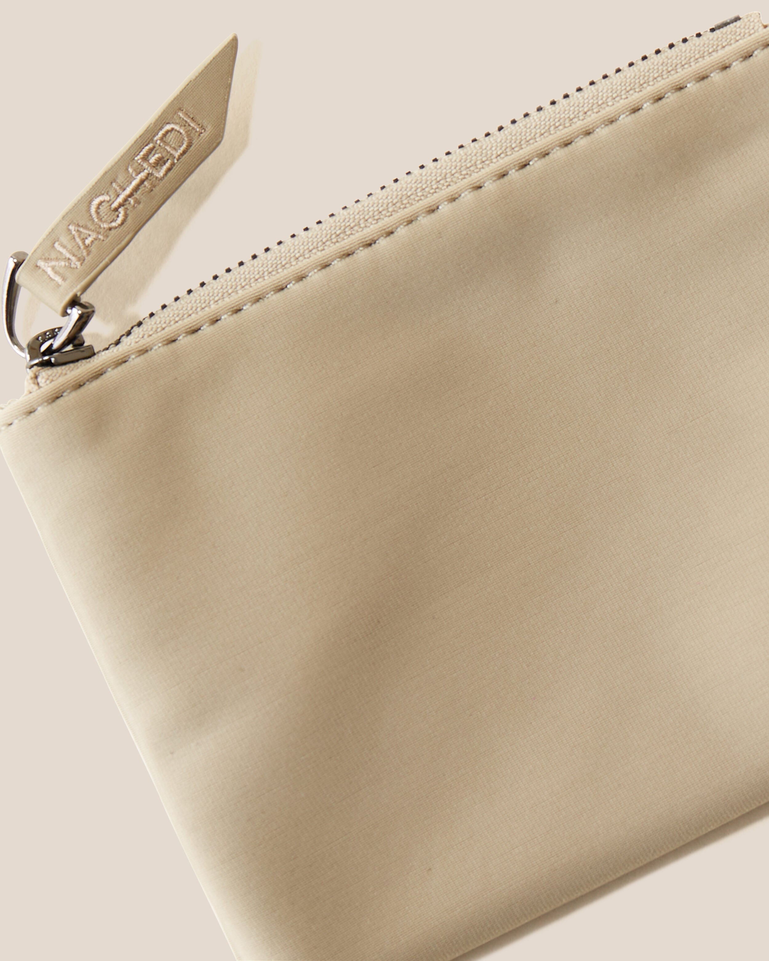 Close-up of included coordinating neoprene zippered pouch.