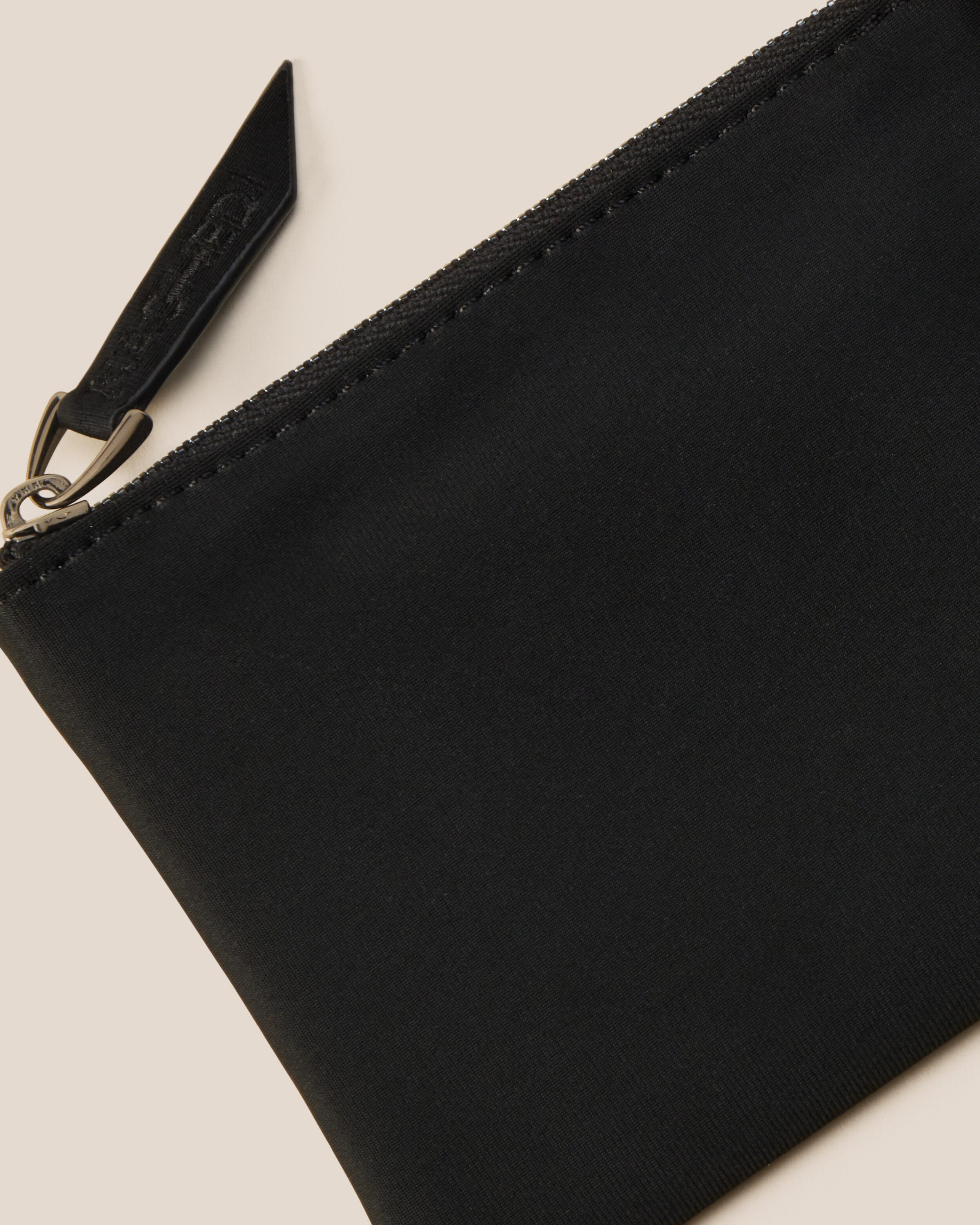 Close-up of included coordinating neoprene zippered pouch.