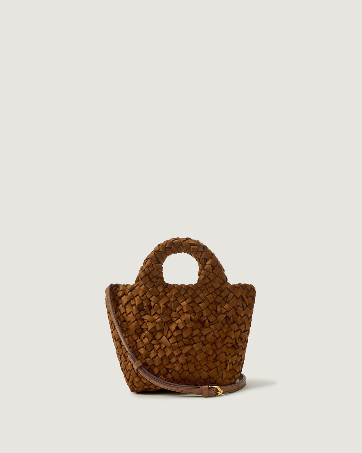 A saddle brown woven basket-style neoprene handbag with a top handle and a leather shoulder strap.