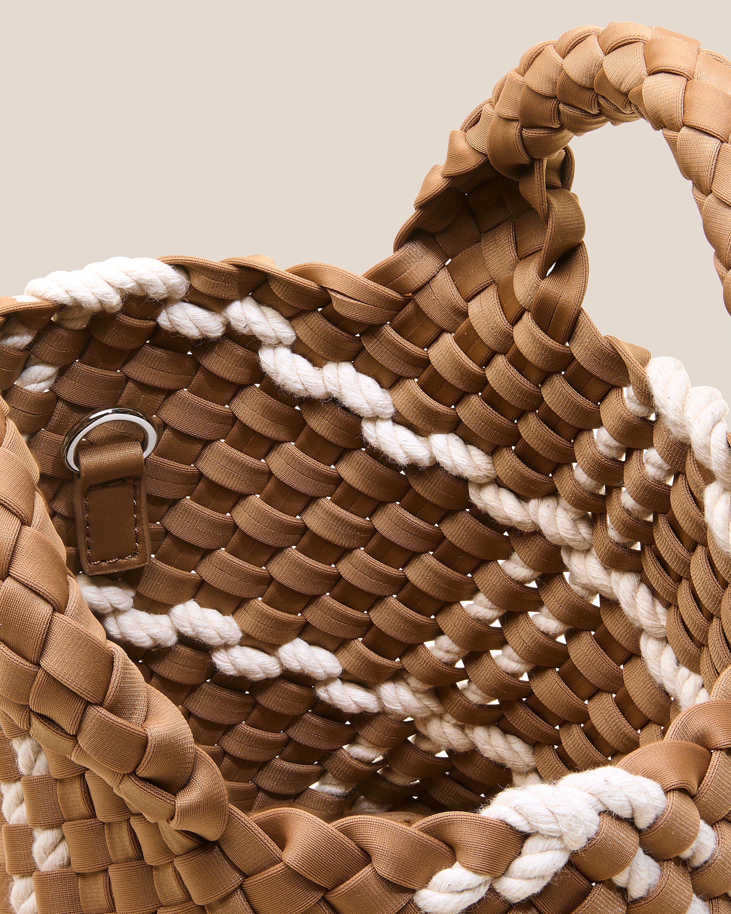 Interior close-up of St. Barths Tote in Cove showing its open top, and unlined interior.