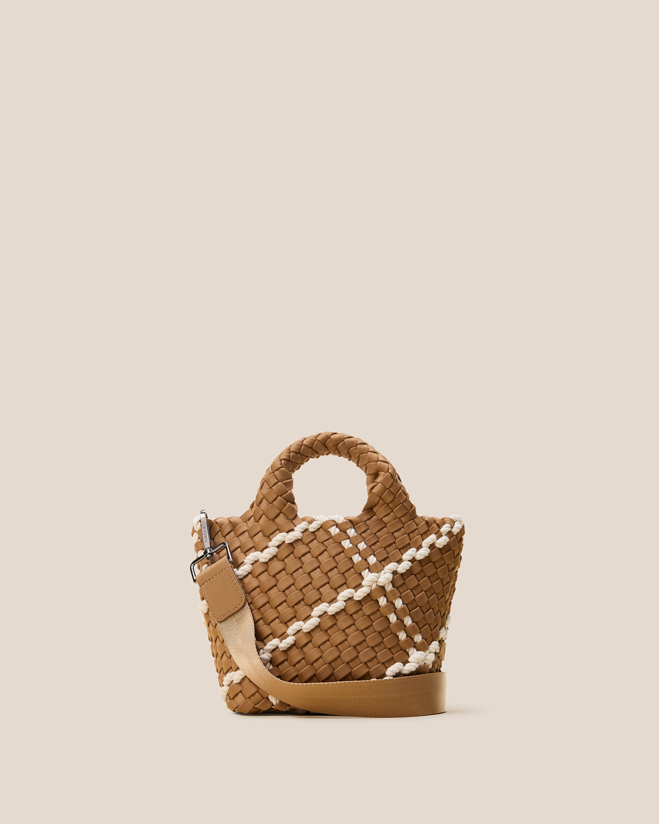 St. Barths Tote in Cove, a tan brown tone, in handwoven neoprene, featuring an open top, woven top handles, and detachable, adjustable nylon crossbody strap.