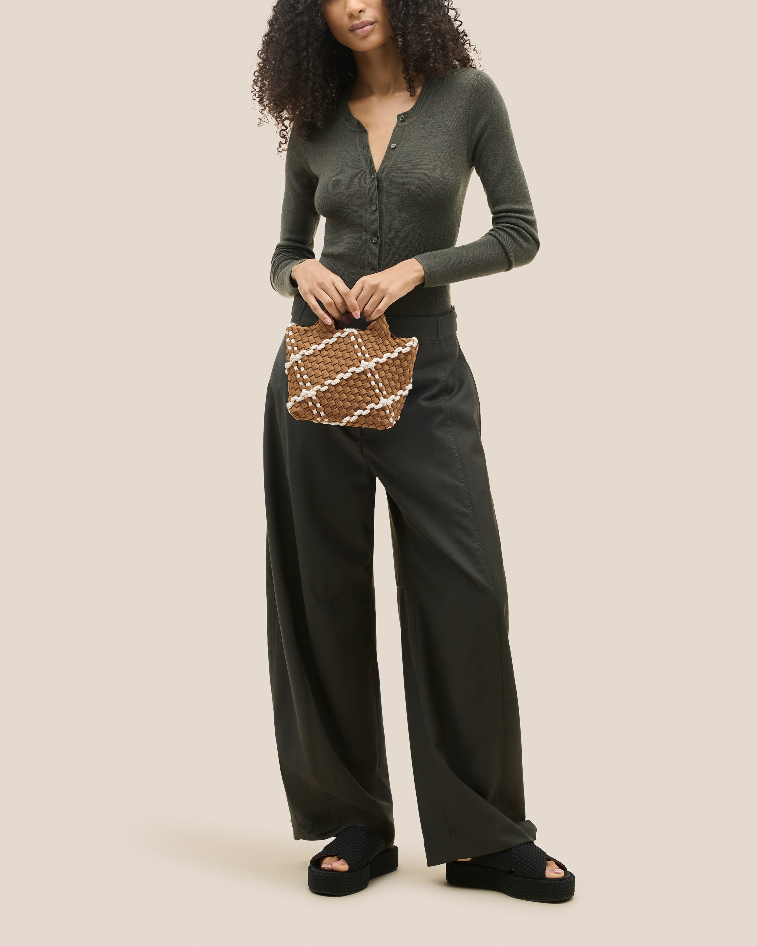 St. Barths Tote in Cove shown on model to illustrate scale and soft silhouette.
