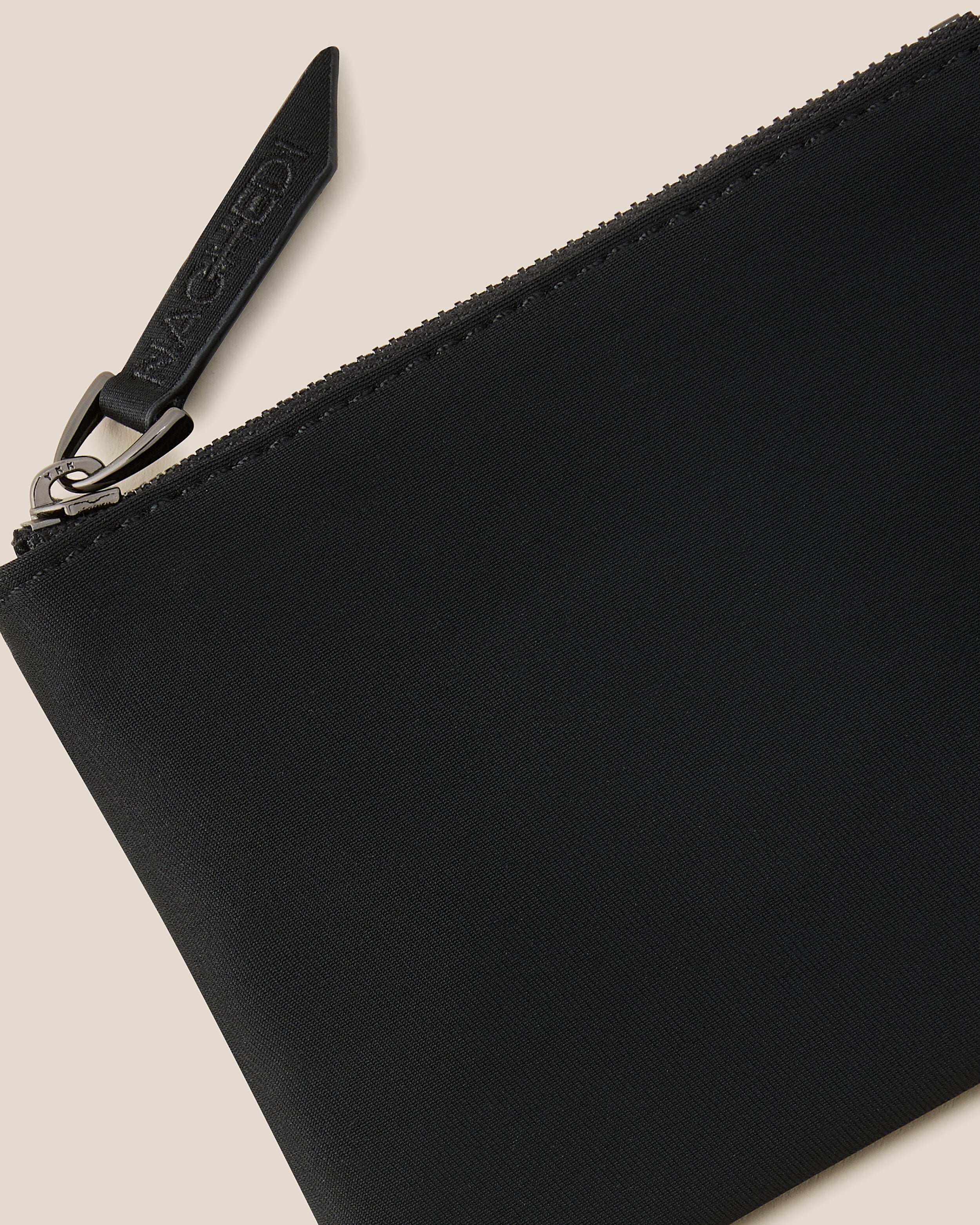 Close-up of included coordinating neoprene zippered pouch.