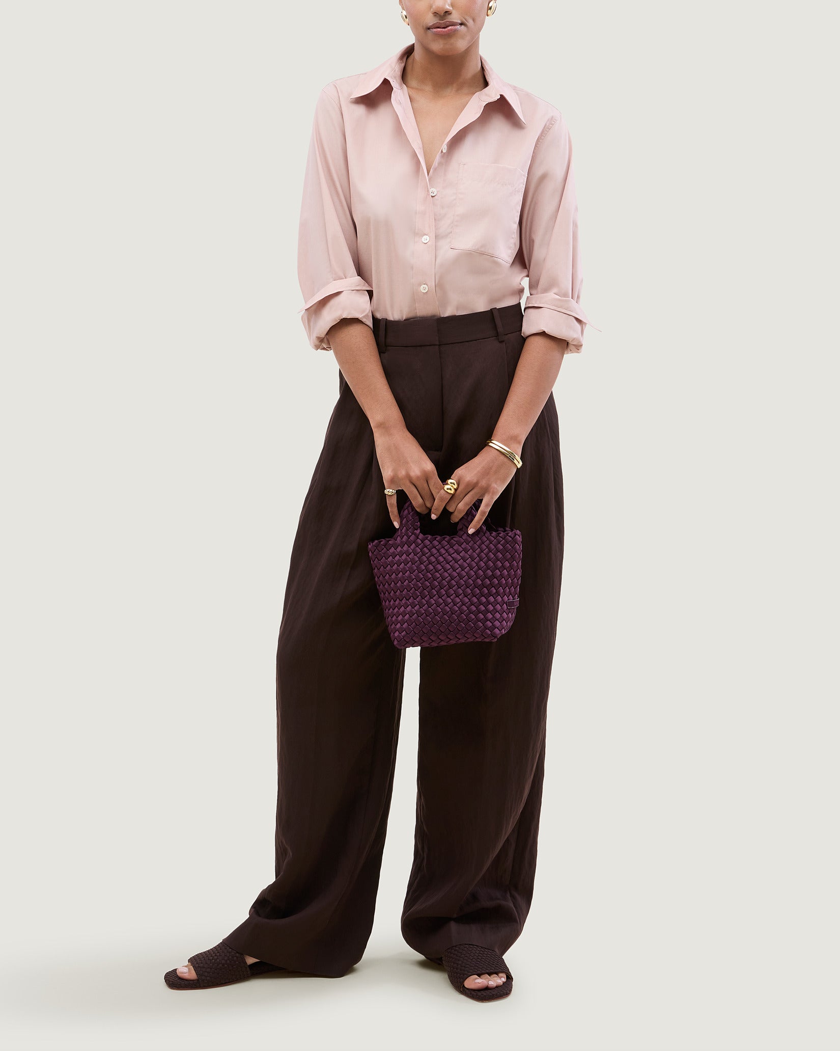 St. Barths Petit Satin Tote Bag in Currant shown on model to illustrate scale and soft silhouette.