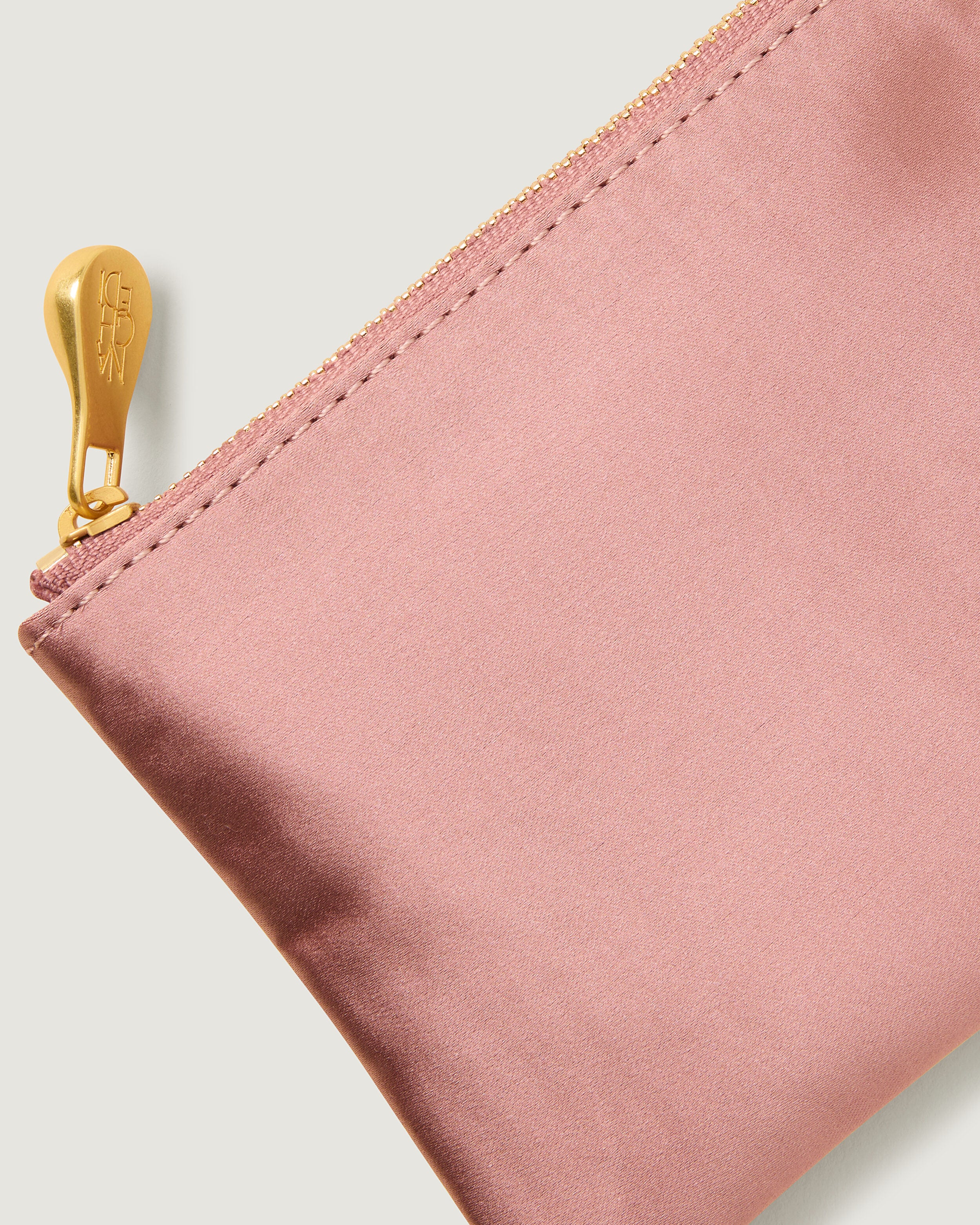 Close-up of included coordinating neoprene zippered pouch.