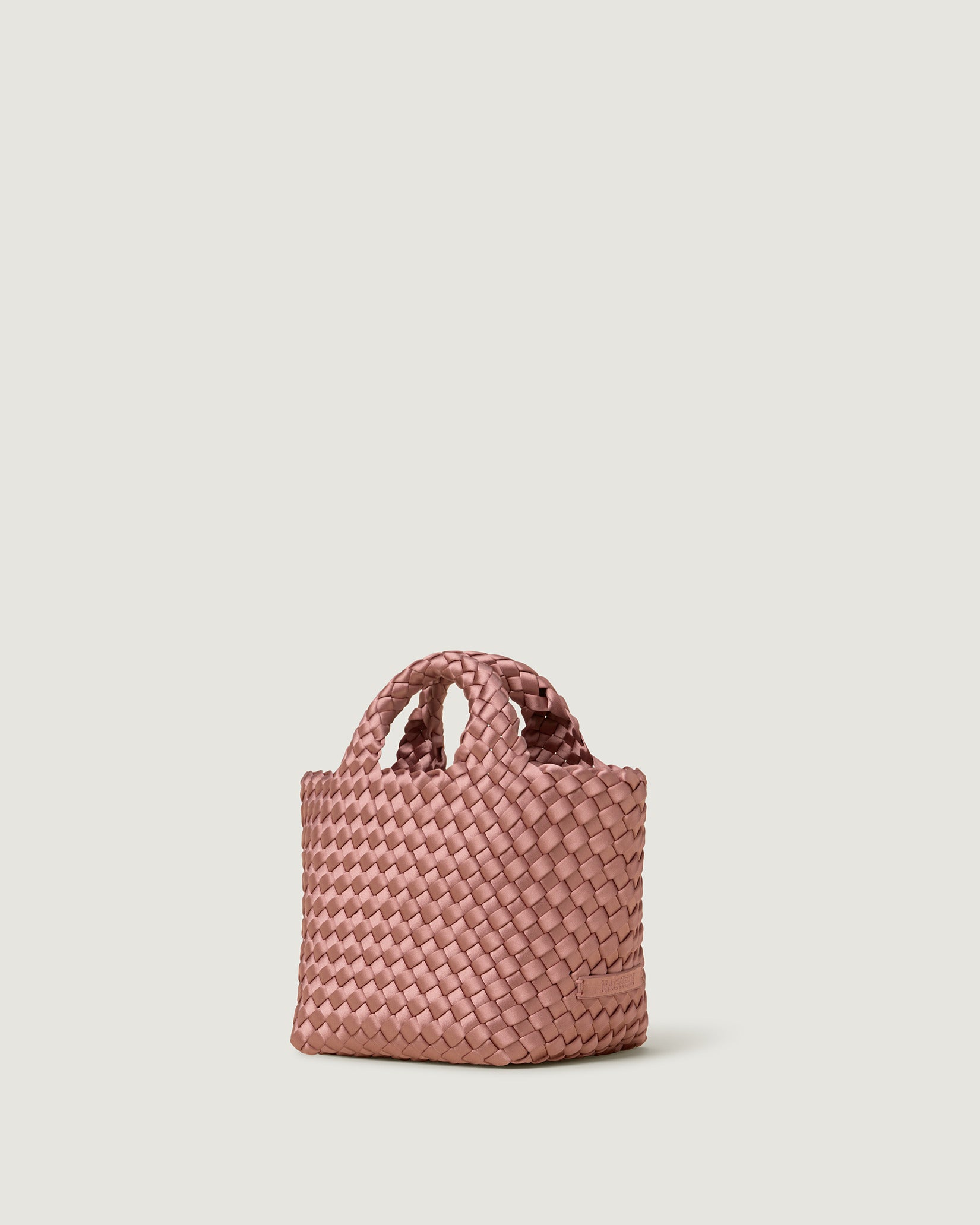 St. Barths Petit Satin Tote Bag in Daphne shown from a side angle, highlighting its handwoven neoprene and open top.