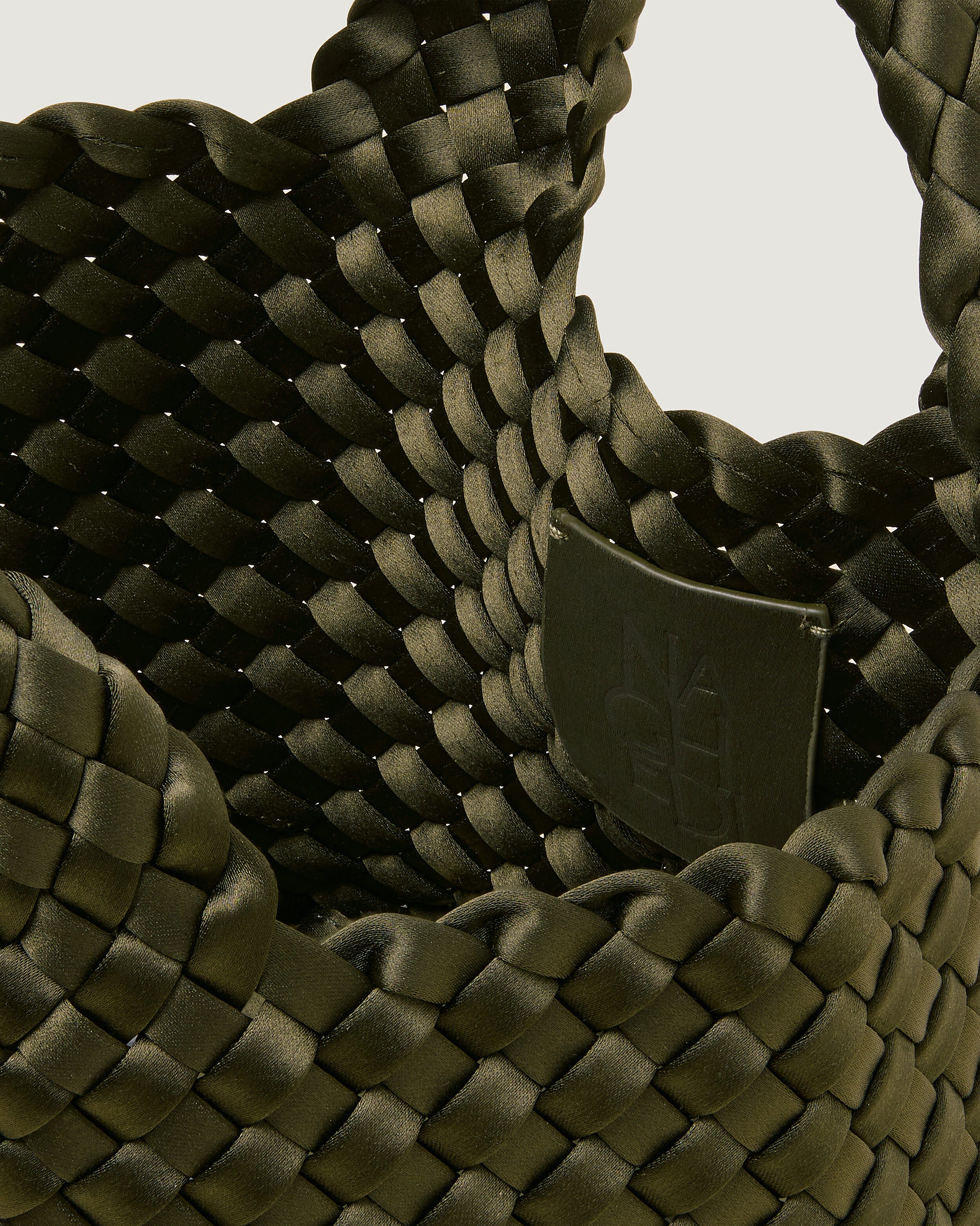 Interior close-up of St. Barths Tote in Juniper showing its open top, and unlined interior.